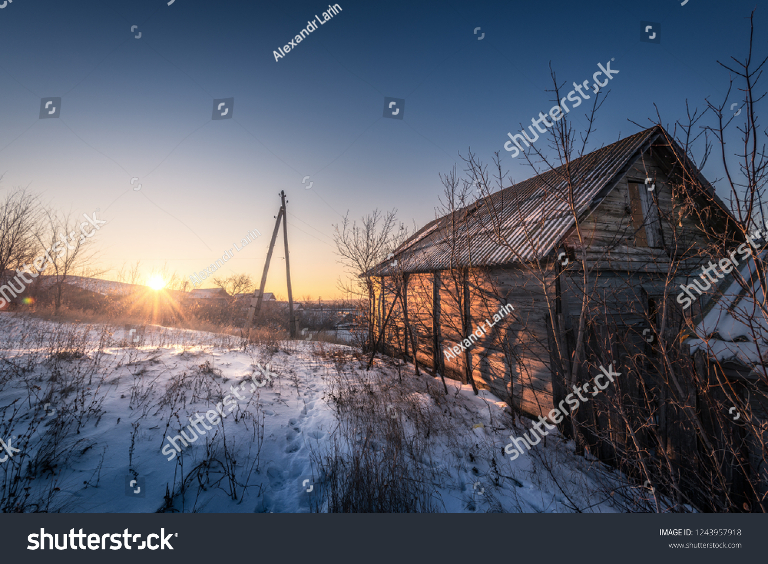 winter russia barn old house footprints in the snow morning dawn #1243957918