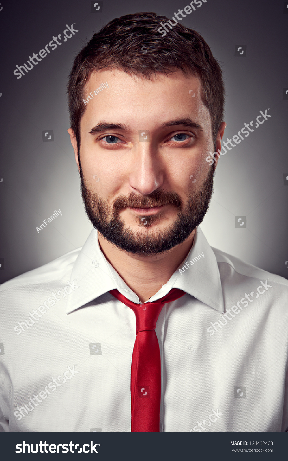 portrait of handsome man in white shirt and red necktie over grey background #124432408