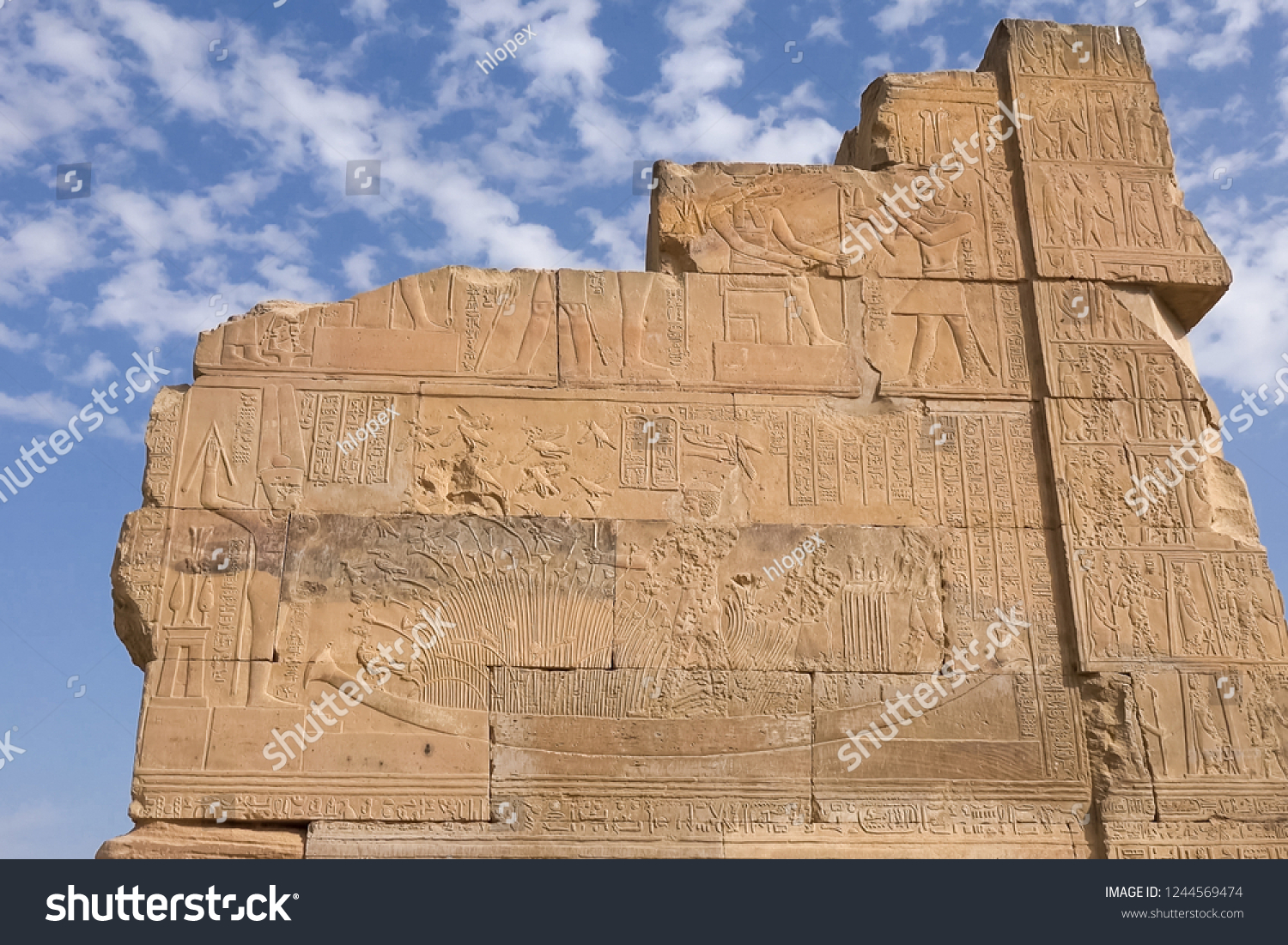 Egyptian hieroglyphs and drawings on the walls and columns. Egyptian language, The life of ancient gods and people in hieroglyphics and drawings #1244569474