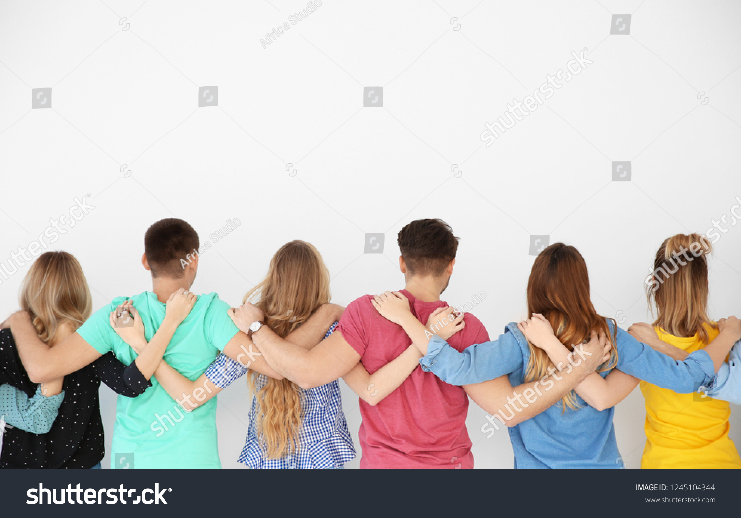 Young people together on light background. Unity concept #1245104344