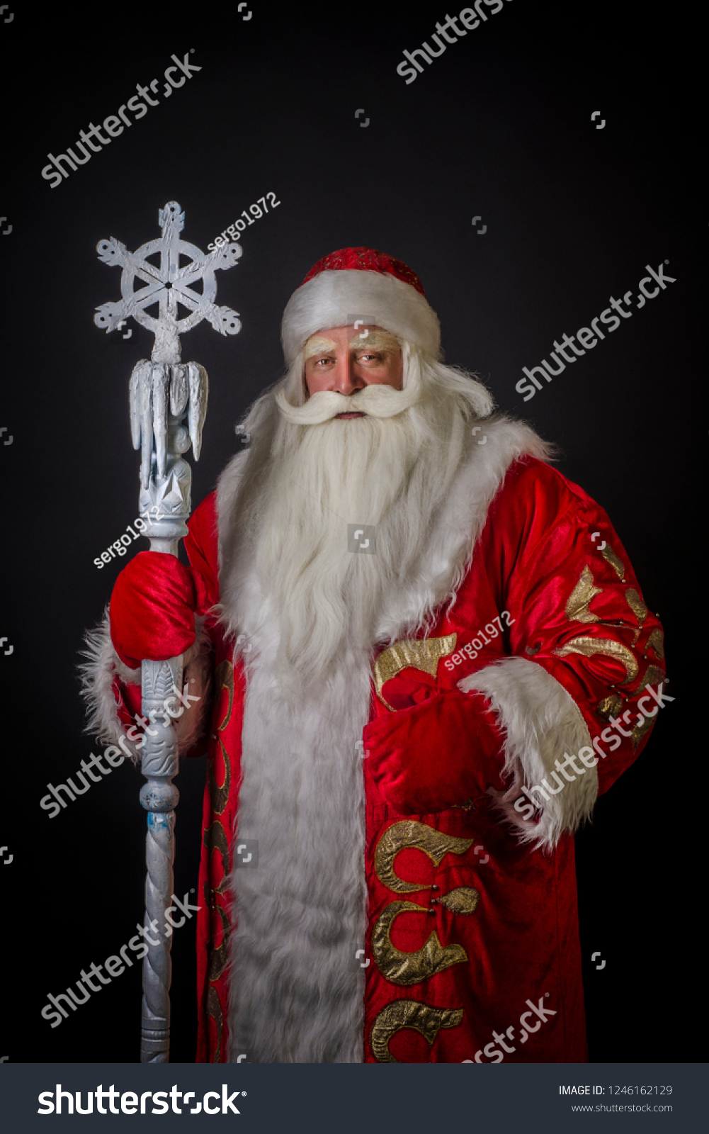 Santa Claus and Santa Claus on a black background. Santa Claus and Santa Claus are majestic and original with a staff on a black background. #1246162129
