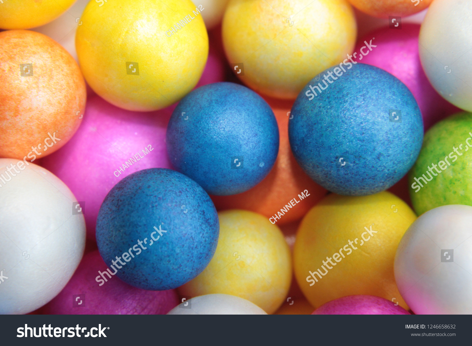 Color Styrofoam balls. Wedding Decorative Polystyrene Spheres Baubles, bright colors background. #1246658632