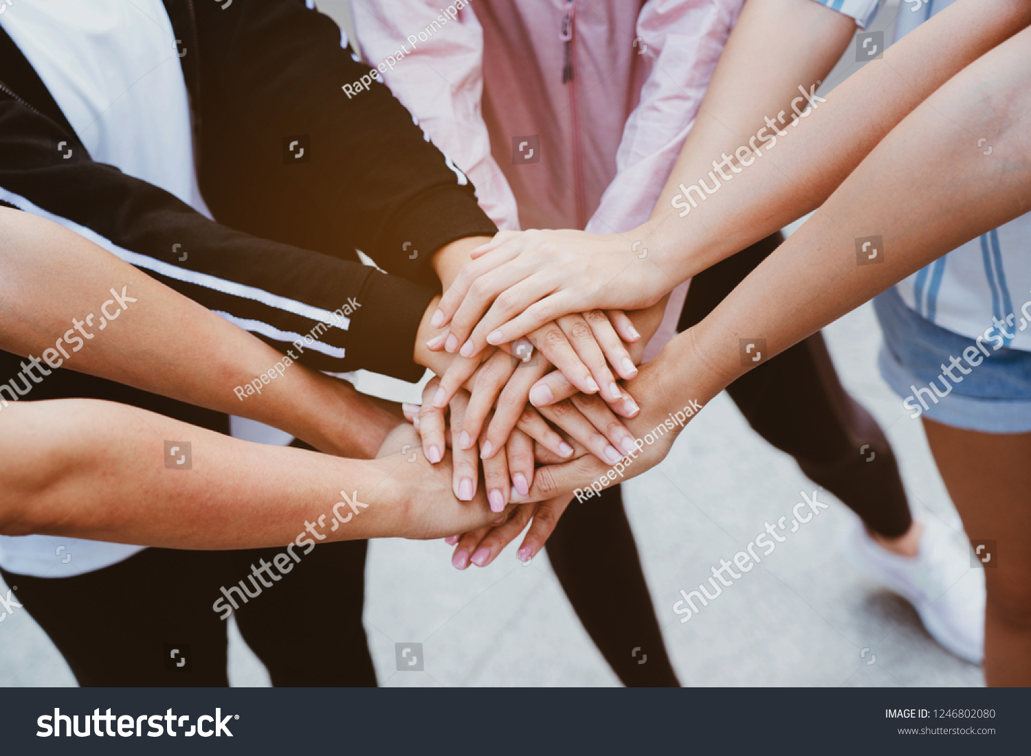 Teamwork is a combination of hands. Is a large group of people who have the work efficiency. Show unity as a collaborative work together. To succeed, Concept Collaboration Volunteer #1246802080