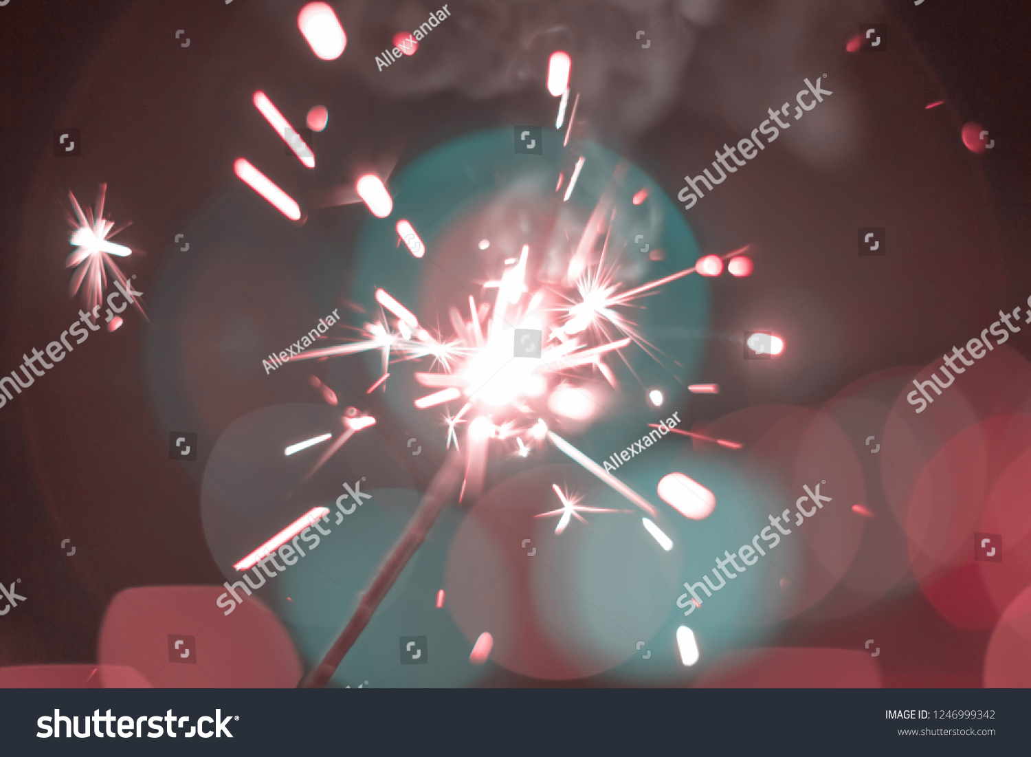 Sparkler Bokeh Colorful sparkler. Night background with a sparkler.  #1246999342