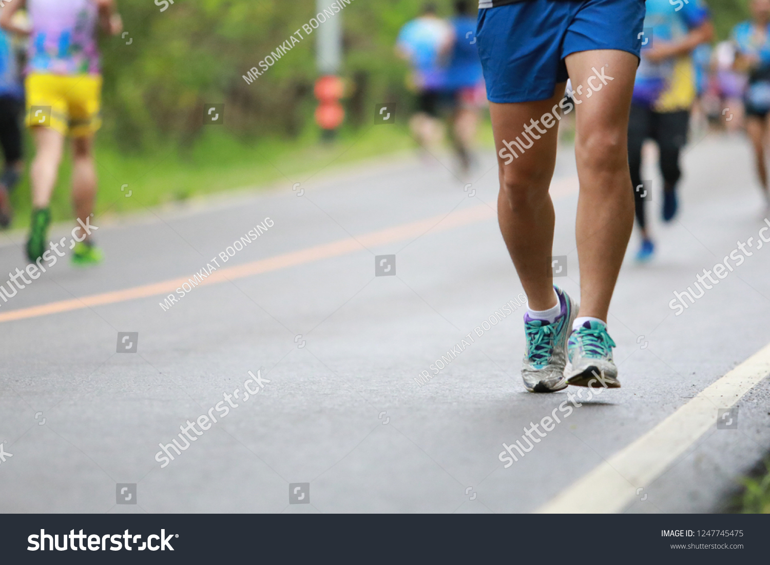 Group of people running race marathon #1247745475