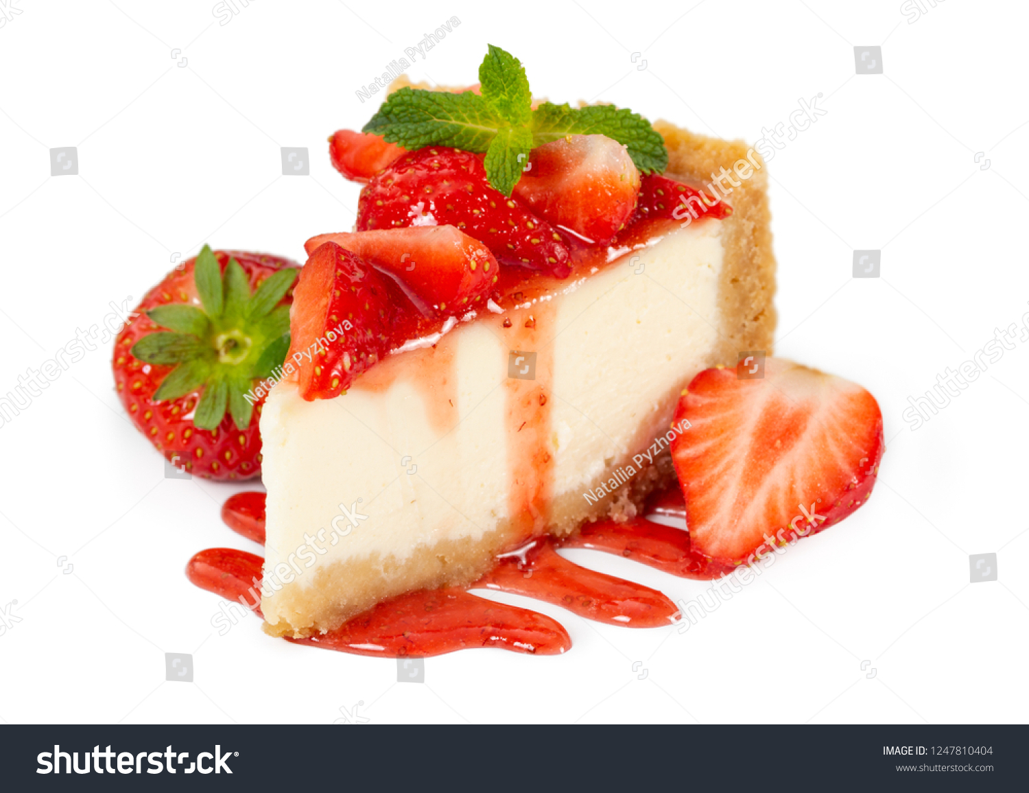 Piece of cheesecake with fresh strawberries and mint isolated on white background #1247810404