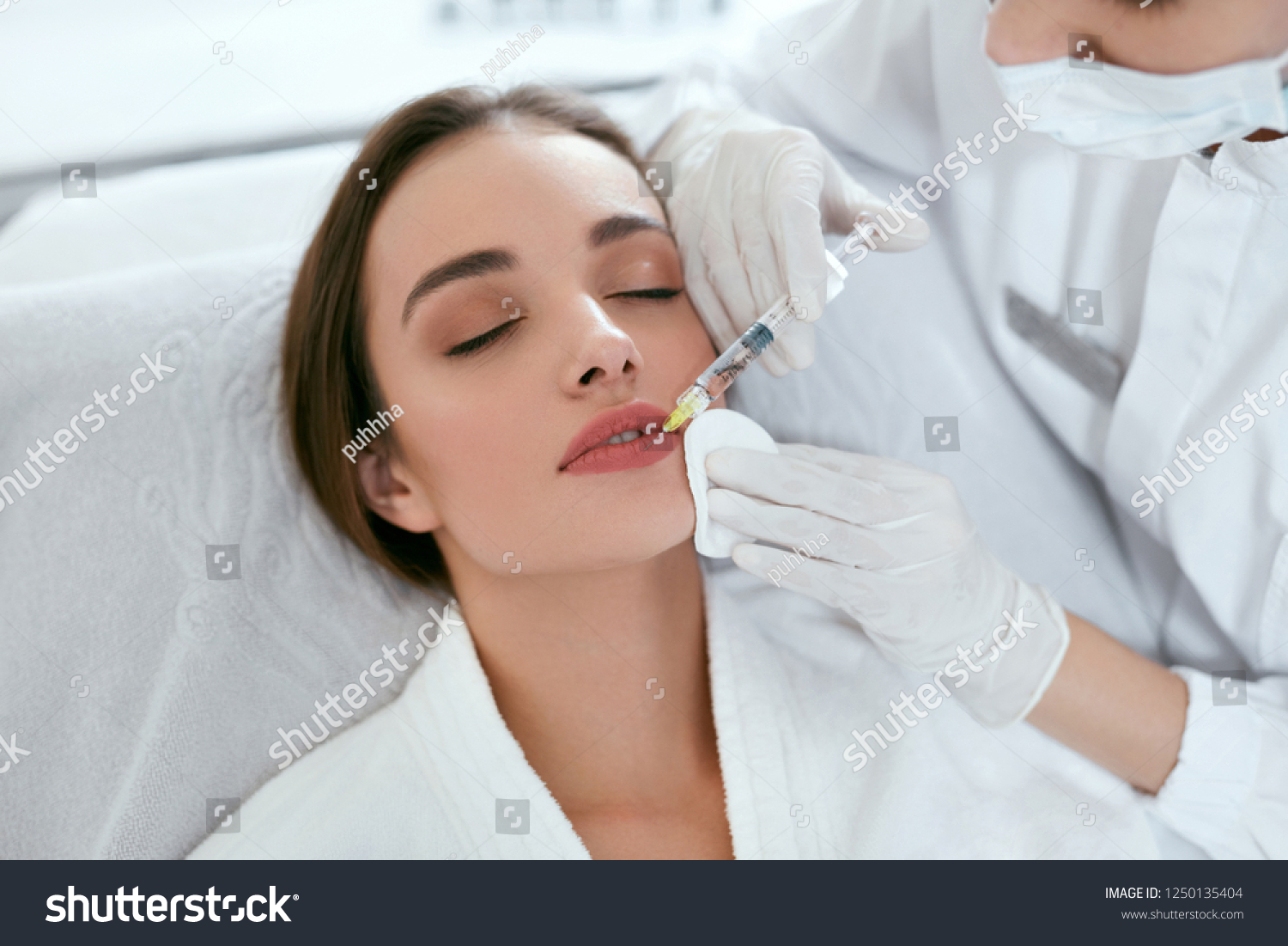 Lip Augmentation. Woman Getting Beauty Injection For Lips #1250135404