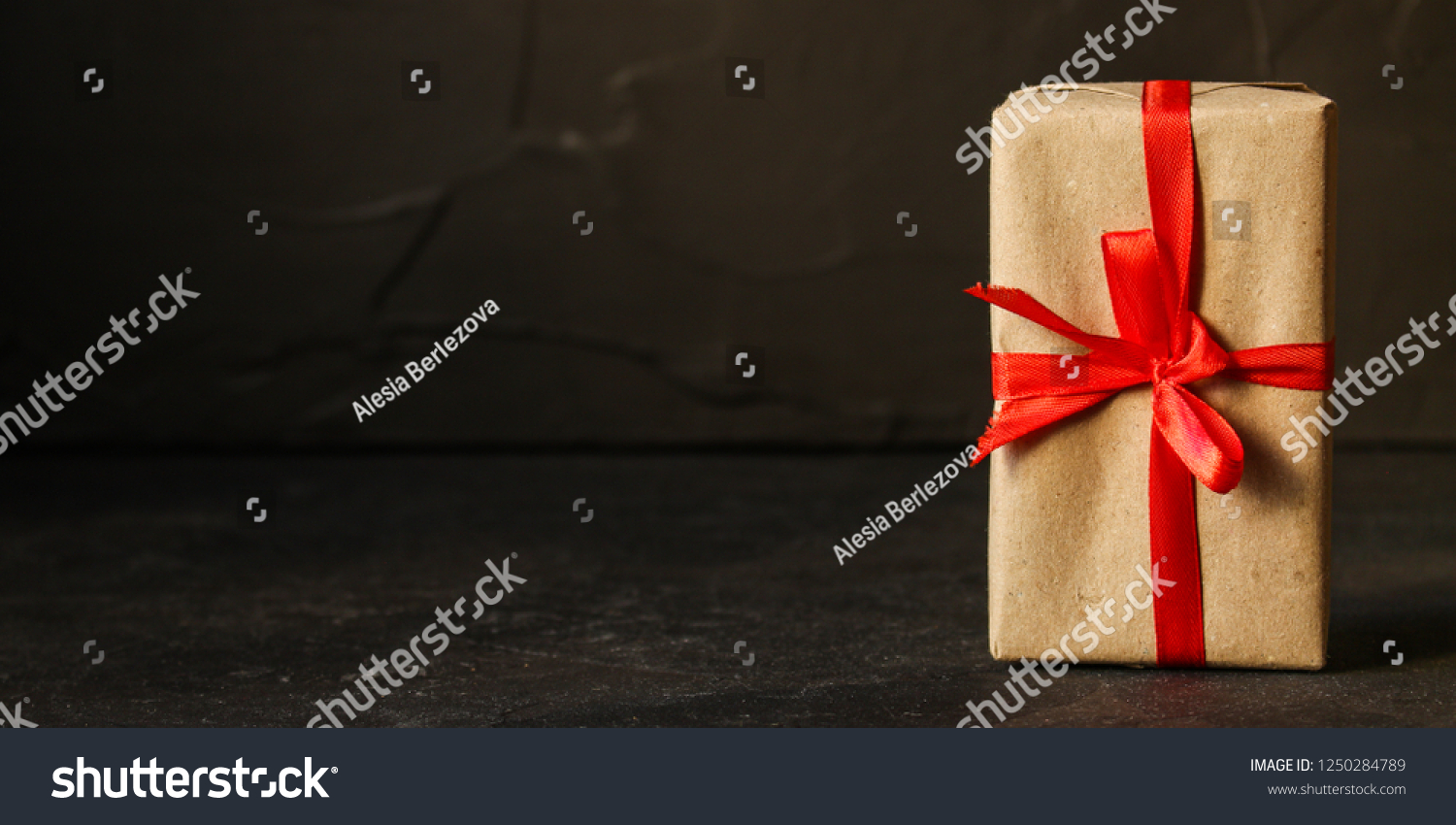 Gift Box, Ribbon - Kraft Paper
 (dark background). top view, copy spac #1250284789