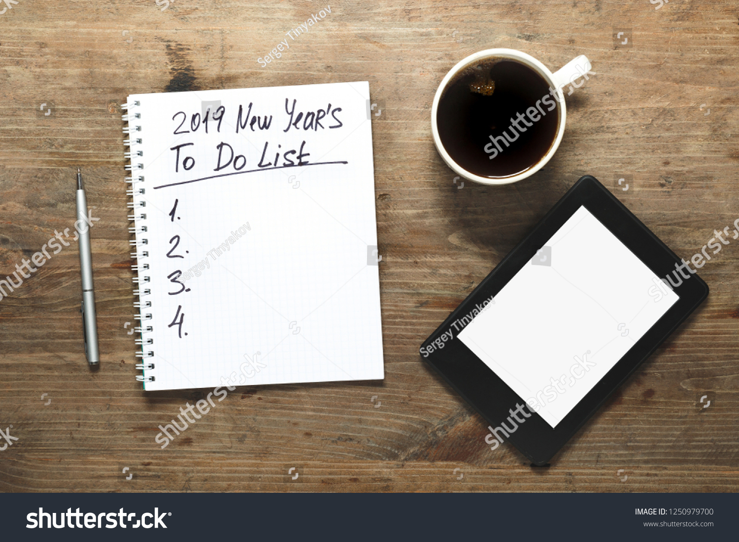 New year 2019 Motivation Concept. Number and text on notepad. Tablet, pen and cup of copy background, top view, flat lay #1250979700