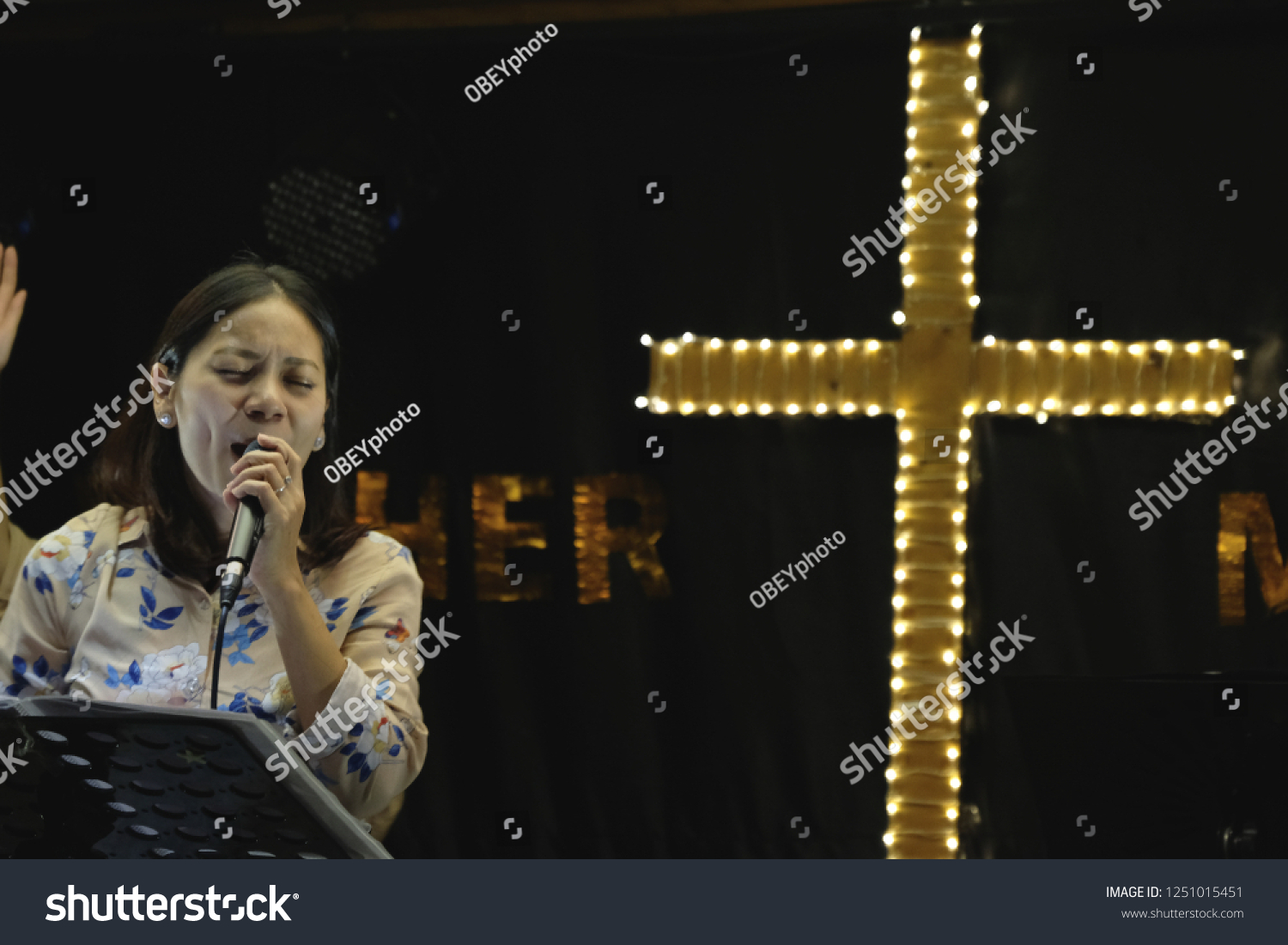 Women sing worship songs in church #1251015451