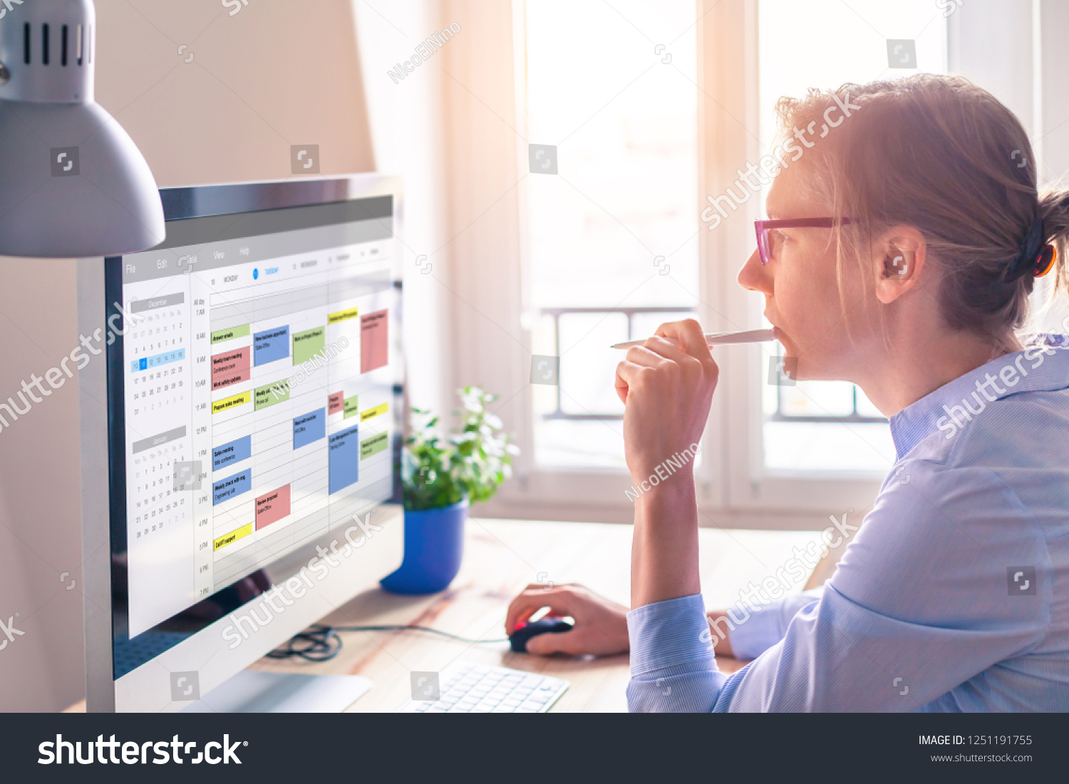 Person using calendar on computer to improve time management, plan appointments, events, tasks and meetings efficiently, improve productivity, organize week day and work hours, business woman, office #1251191755