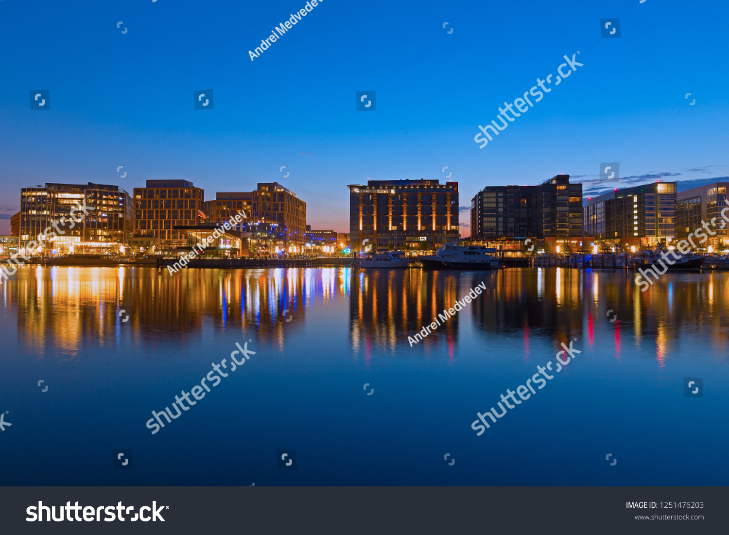 WASHINGTON DC, USA - JULY 28, 2018: The Wharf of US capital at night.  It is located along the Washington Channel, just south of the National Mall and west of the newly developed Capitol Riverfront. #1251476203