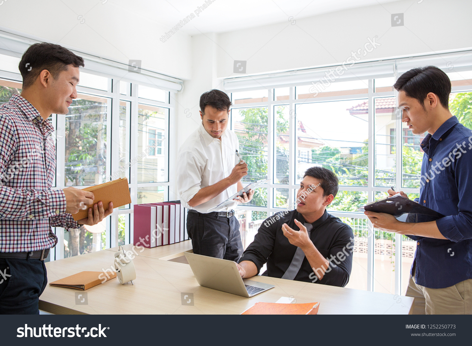 Businessman plaining data at meeting room. Business people meeting around desk. Asian people. Young business man. Asian people. #1252250773