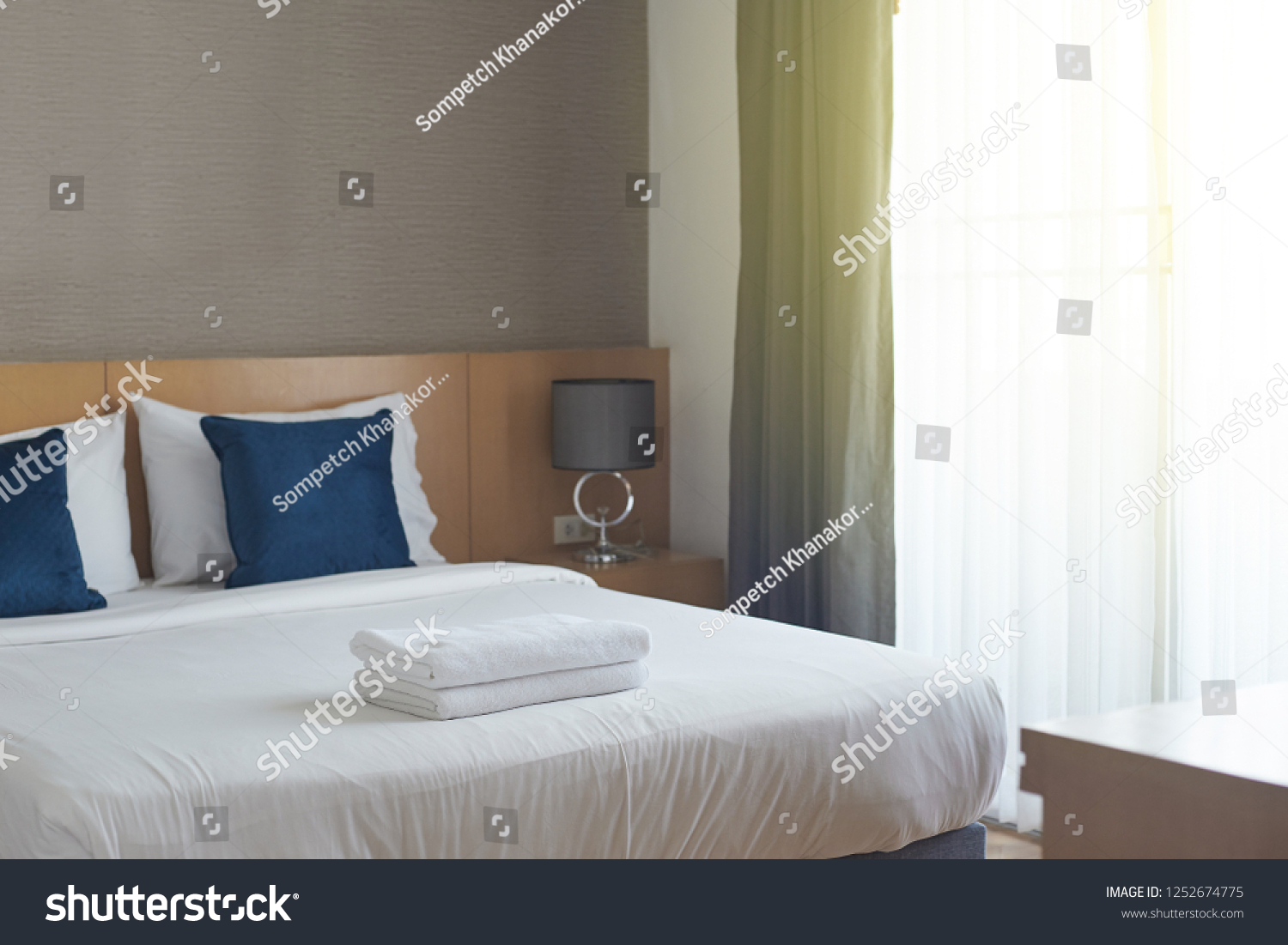 Hotel room , Condominium or apartment doorway with open door in front of blur bedroom background #1252674775