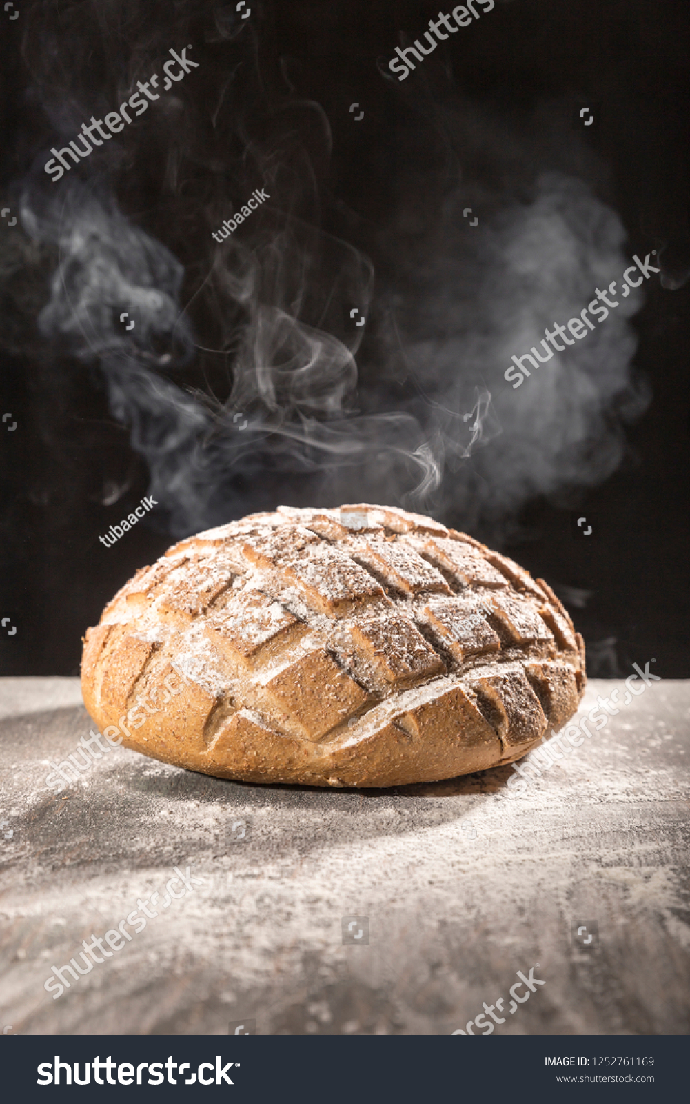 March 18, 2015 Hot Steamed homemade flour and bread in studio shot on black background #1252761169