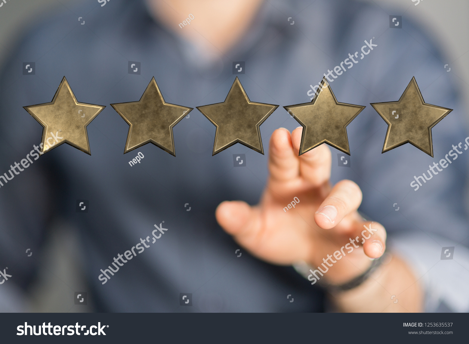 rating with star in hand #1253635537