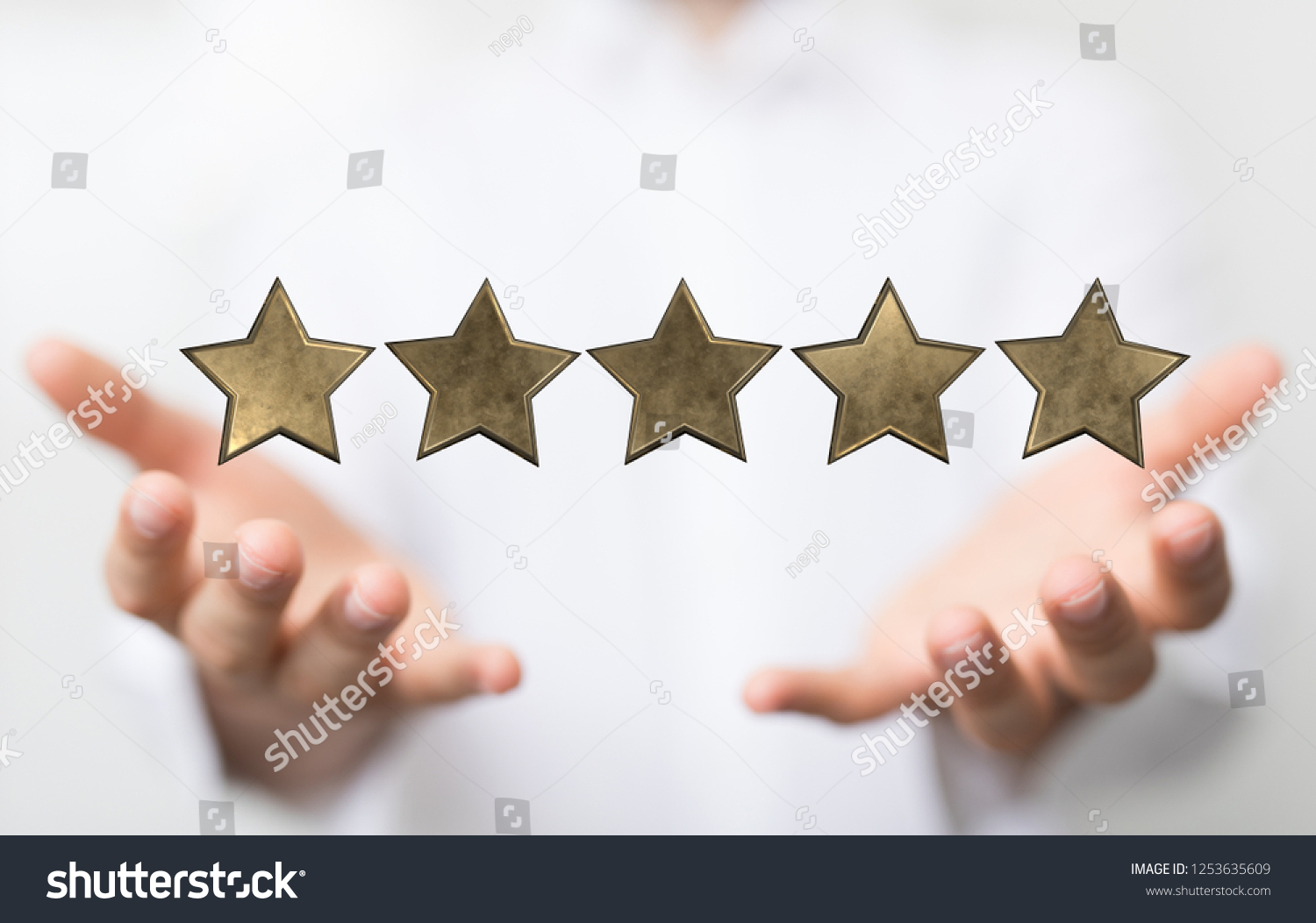 rating with star in hand #1253635609
