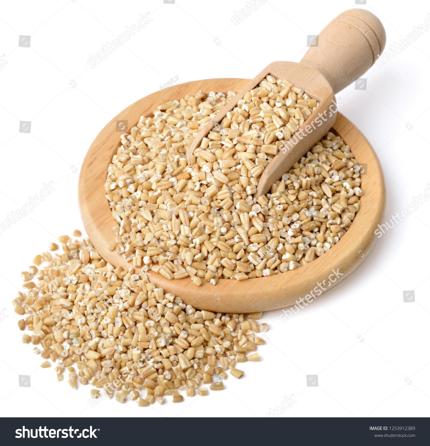 raw steel cut oats in the wooden scoop and plate, isolated on the white background #1253912389