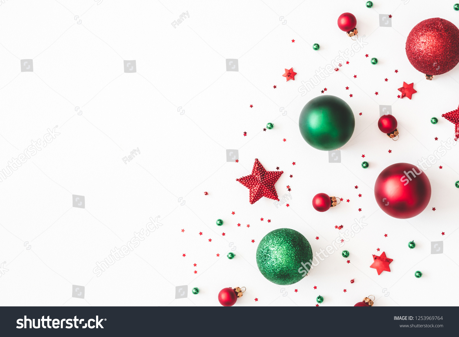 Christmas composition. Christmas red and green decorations on white background. Flat lay, top view, copy space #1253969764