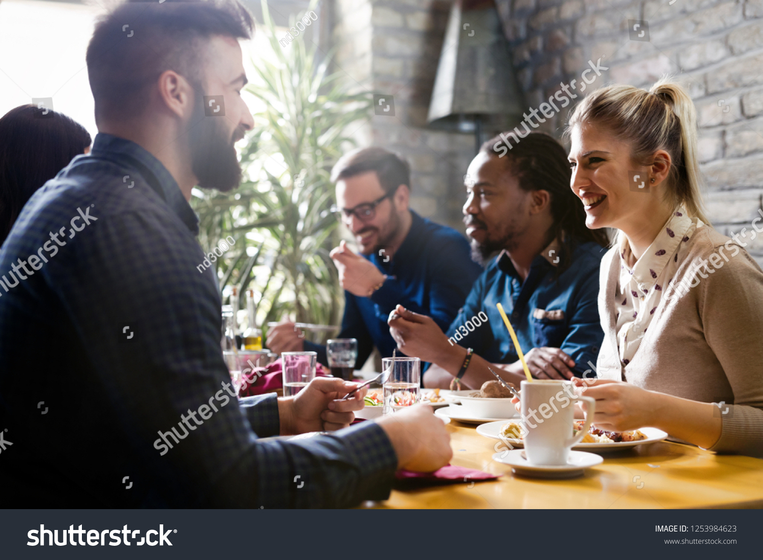Happy young friends hangout in coffee shop #1253984623