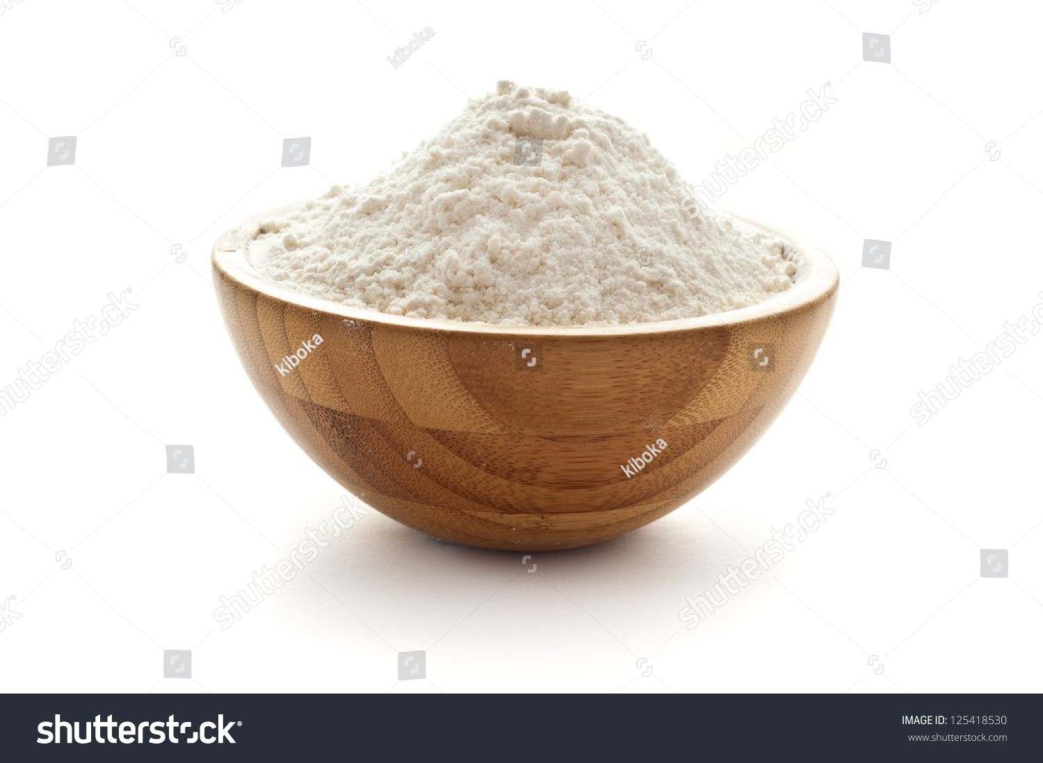 wheat flour in wooden bowl #125418530