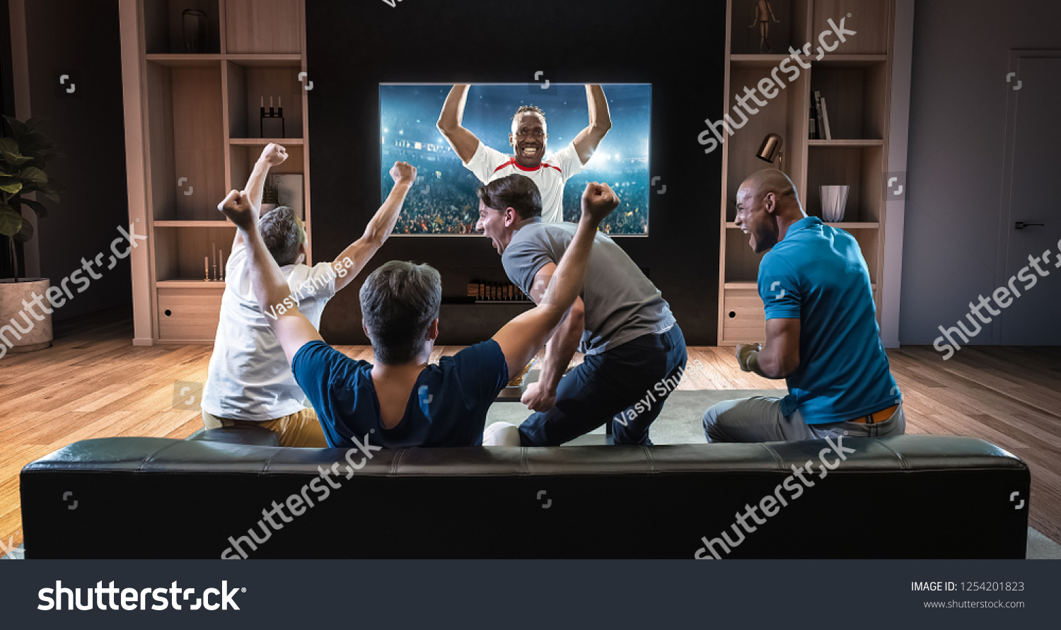 Group of students are watching a soccer moment on the TV and celebrating a goal, sitting on the couch in the living room. The living room is made in 3D. #1254201823