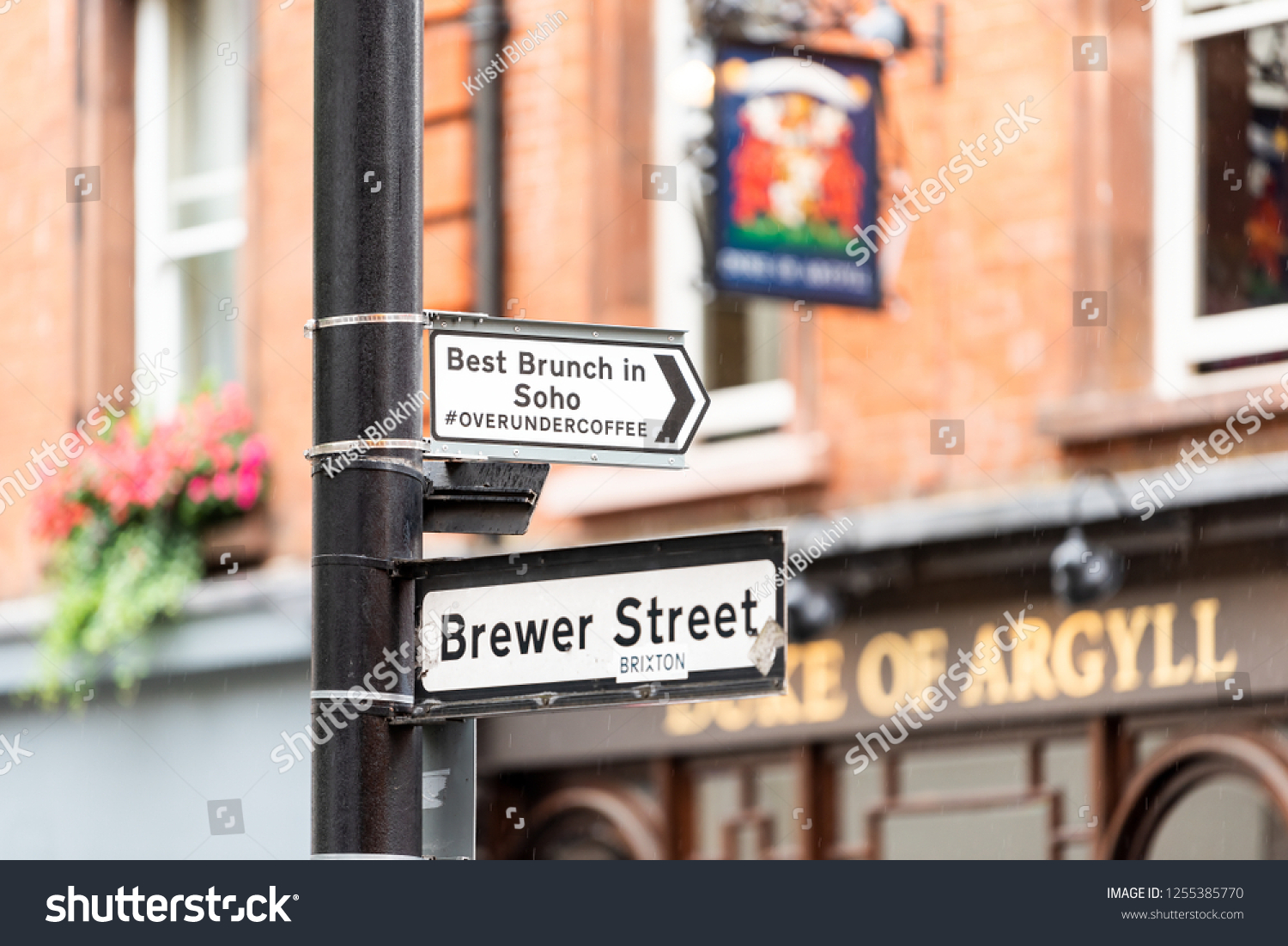 London, UK - September 12, 2018: Closeup of famous Brewer Market Street sign with best brunch in Soho overundercoffee hashtag, brixton, and pub called duke of argyll, nobody #1255385770