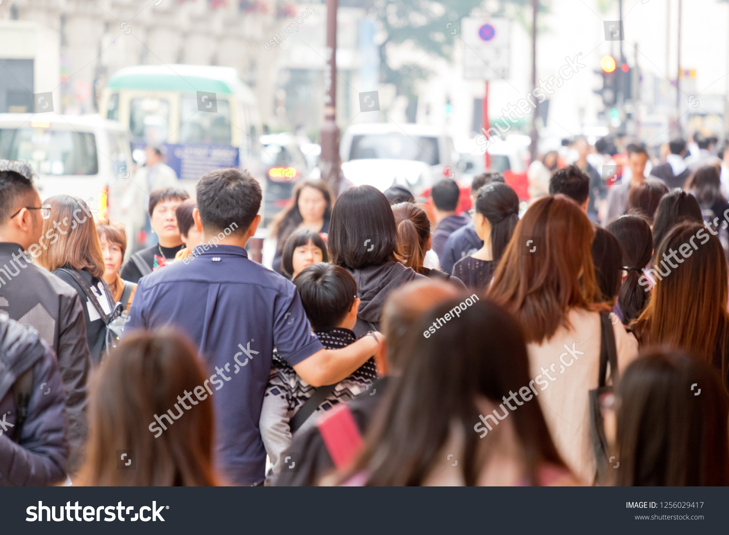 Tsim Sha Tsui, Hong Kong - 08 December, 2018 :  People walking across Canton Road Kowloon, Hong Kong. Canton Road is a major road in Hong Kong.  #1256029417