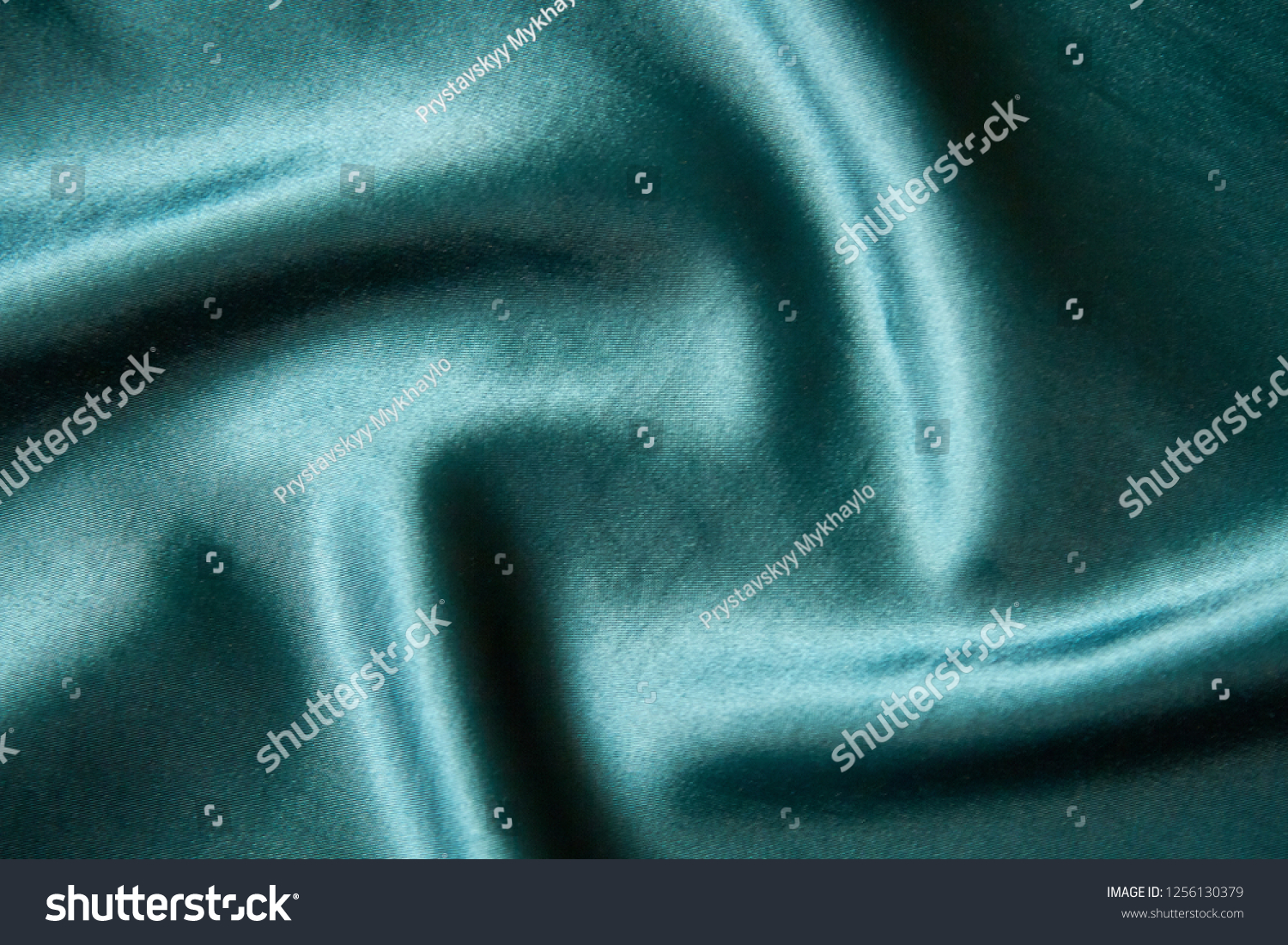 
Dark background. Folds on dark fabric of dark green color. #1256130379