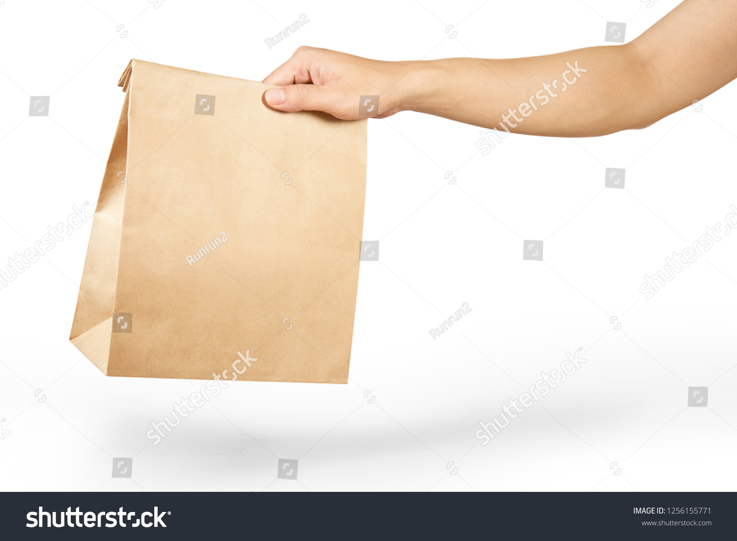 Right hand holidng a brown paper bag isolated on white with clipping path. #1256155771
