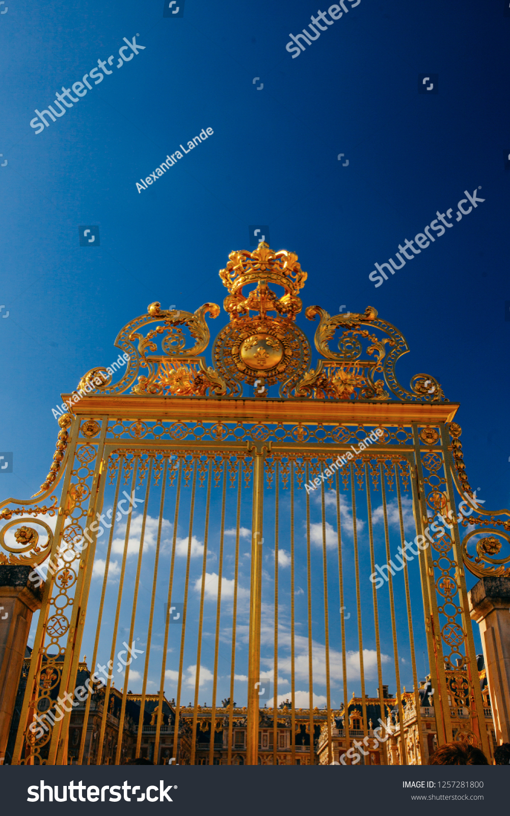 Versailles chateau. France. View of golden gate to palace. Royal residence near Paris. King's quarters. Famous touristic renaissance architecture landmark in summe #1257281800