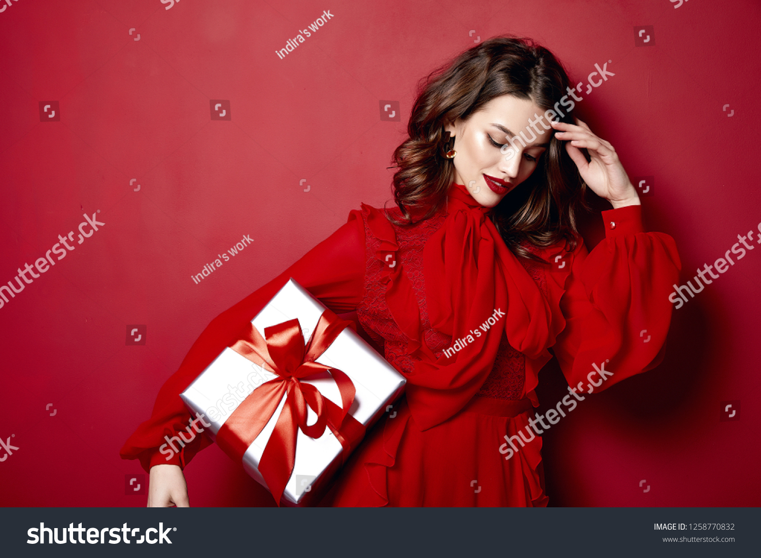 Beautiful young sexy woman thin slim figure evening makeup fashionable stylish dress clothing collection, brunette, gifts boxes red silk bows holiday party birthday New Year Christmas Valentine's Day. #1258770832