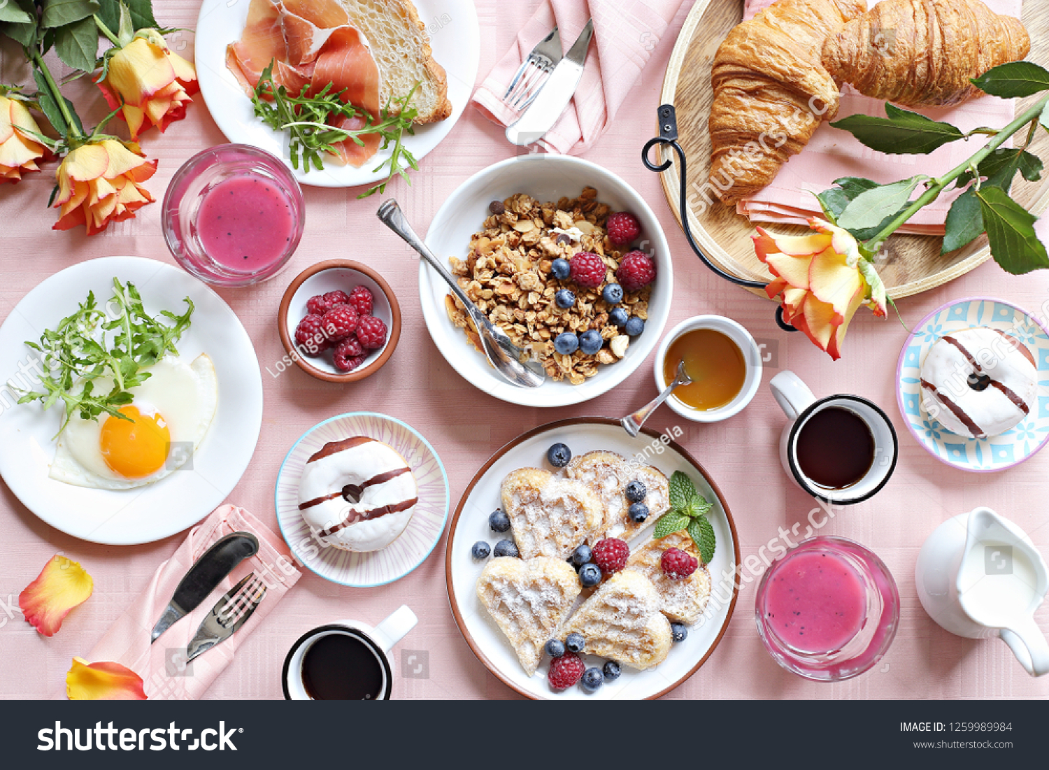 Festive brunch or breakfast set for Valentines day, Mothers day or Easter. Pink background. Overhead view . #1259989984