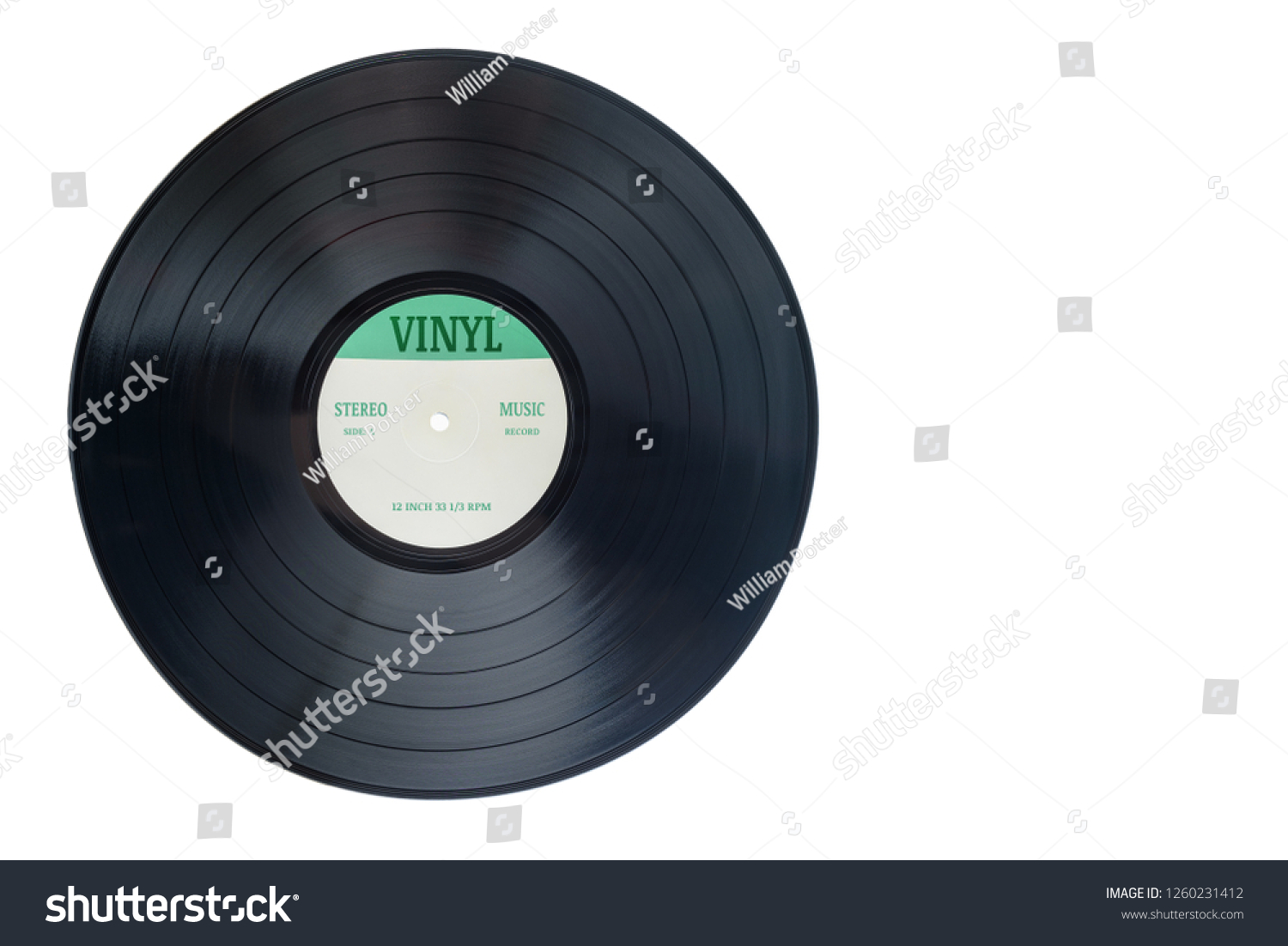 Closeup view of gramophone vinyl LP record or phonograph record with green label. Black musical long play album disc 12 inch 33 rpm spiral groove. Stereo sound record. Isolated on white background. #1260231412