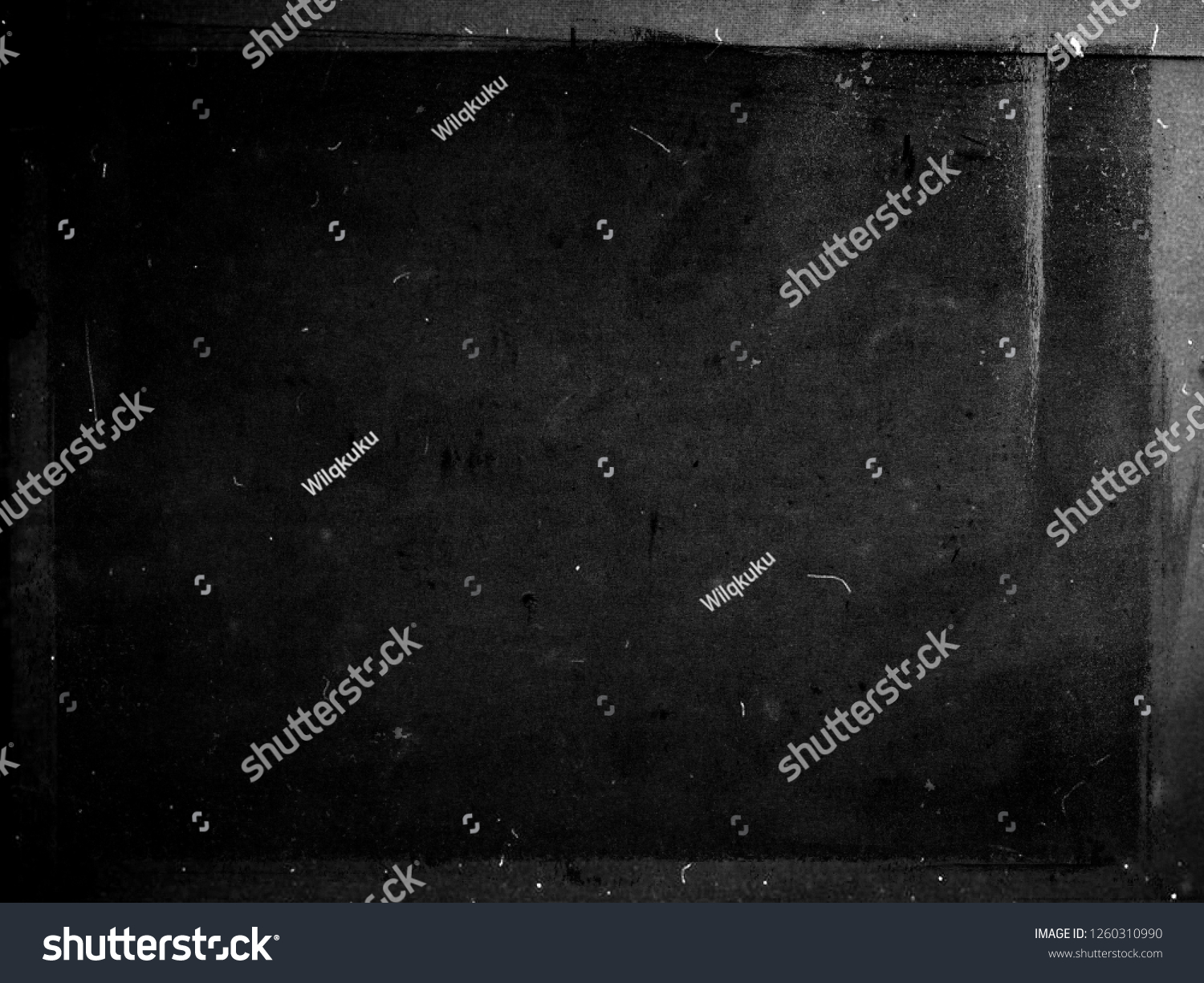 Black grunge scratched scary background with frame, distressed chalkboard, old film effect, copy space #1260310990