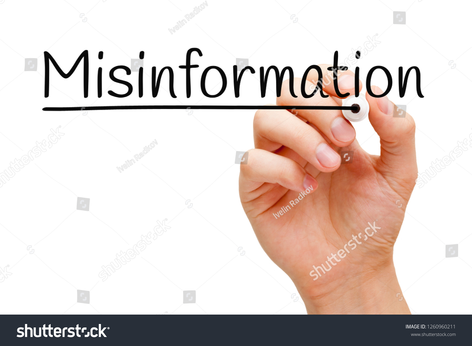 Hand writing the word Misinformation with black marker on transparent wipe board isolated on white. #1260960211