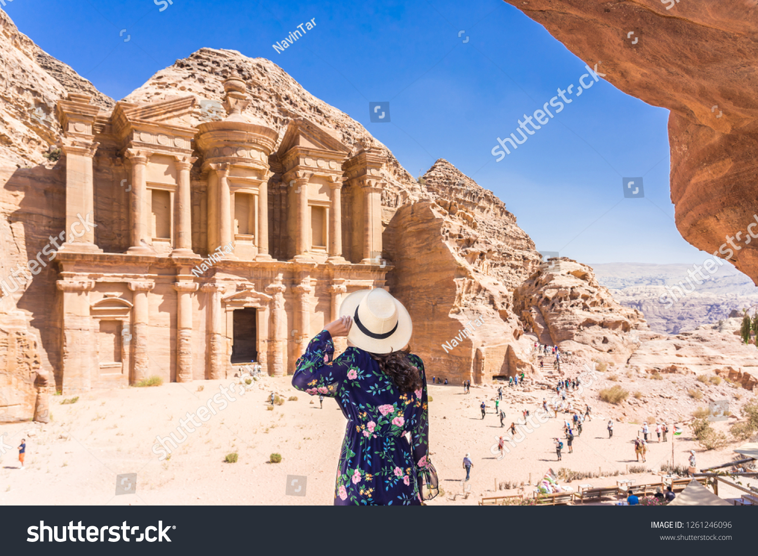 Asian young woman in colorful dress and hat enjoying at The Monastery, Petra's largest monument, UNESCO World Heritage Site, Jordan. #1261246096