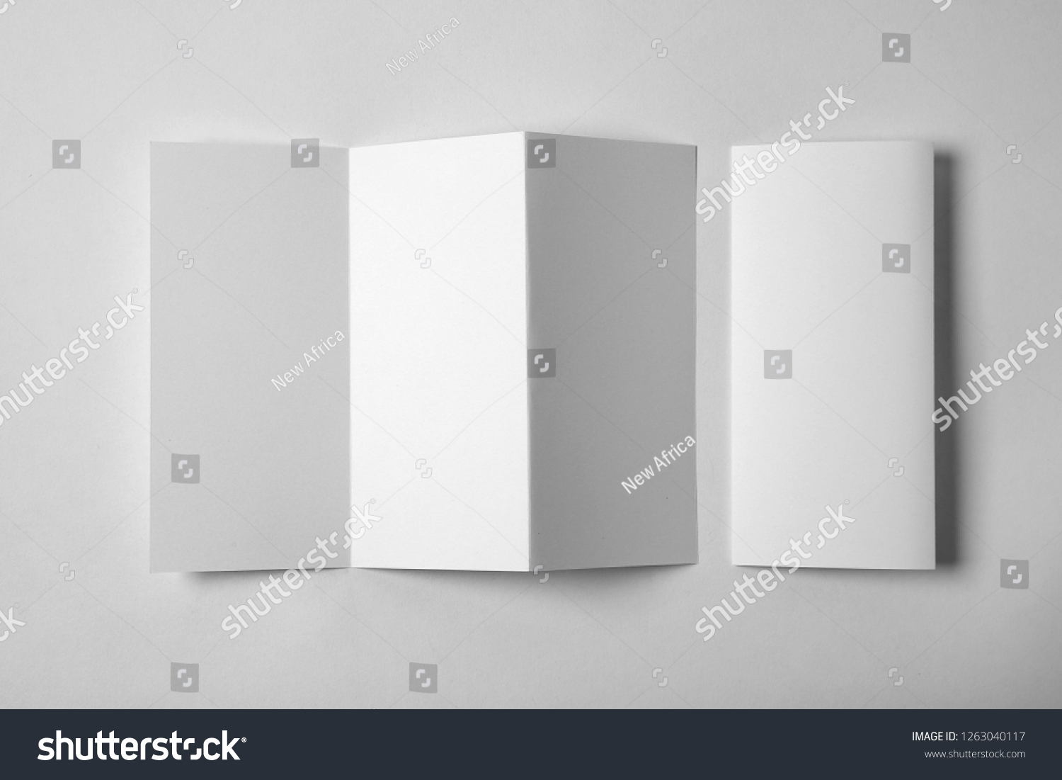 Blank brochure on white background, above view. Mock up for design #1263040117