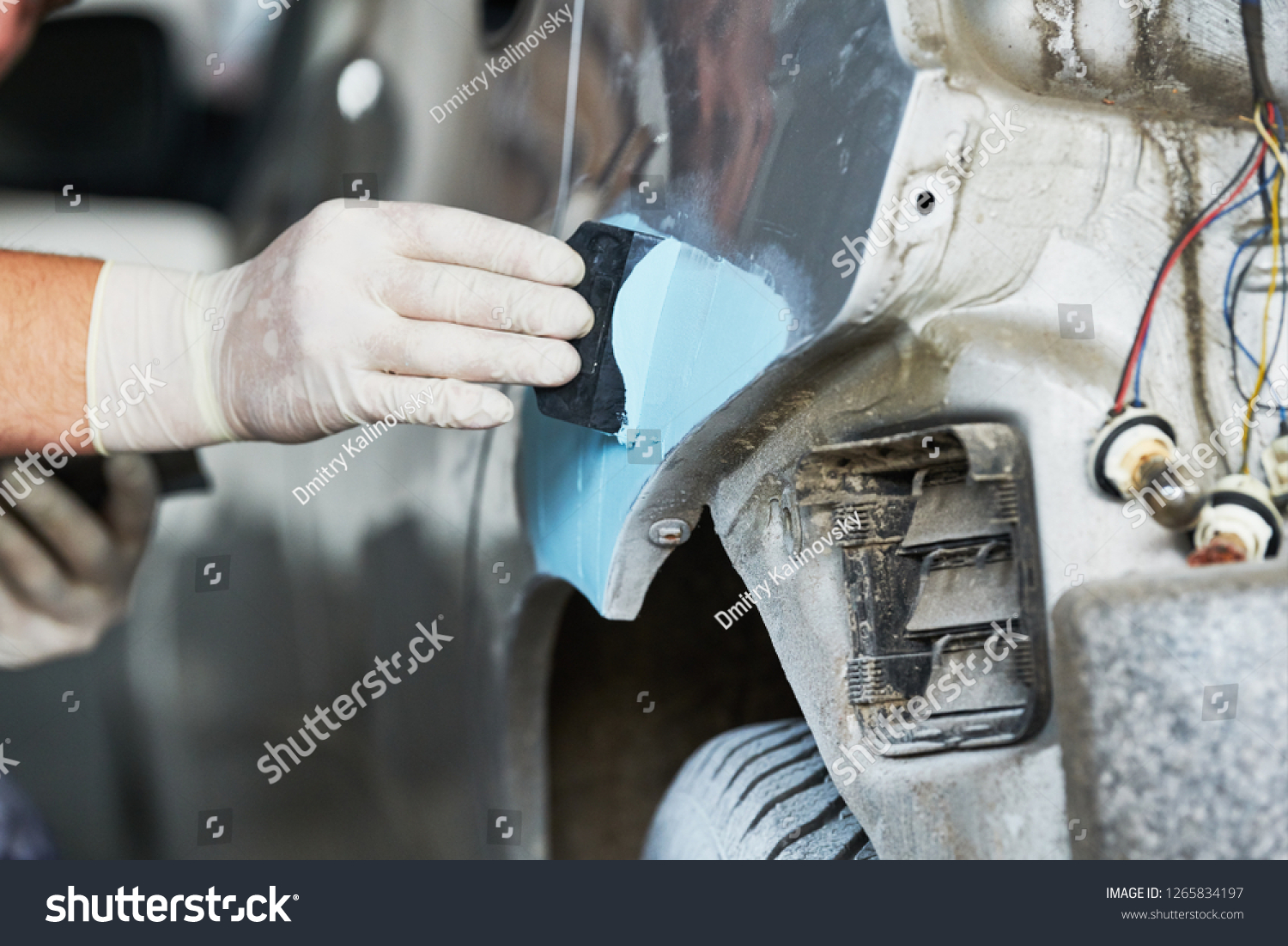 auto repairman plastering autobody bonnet #1265834197