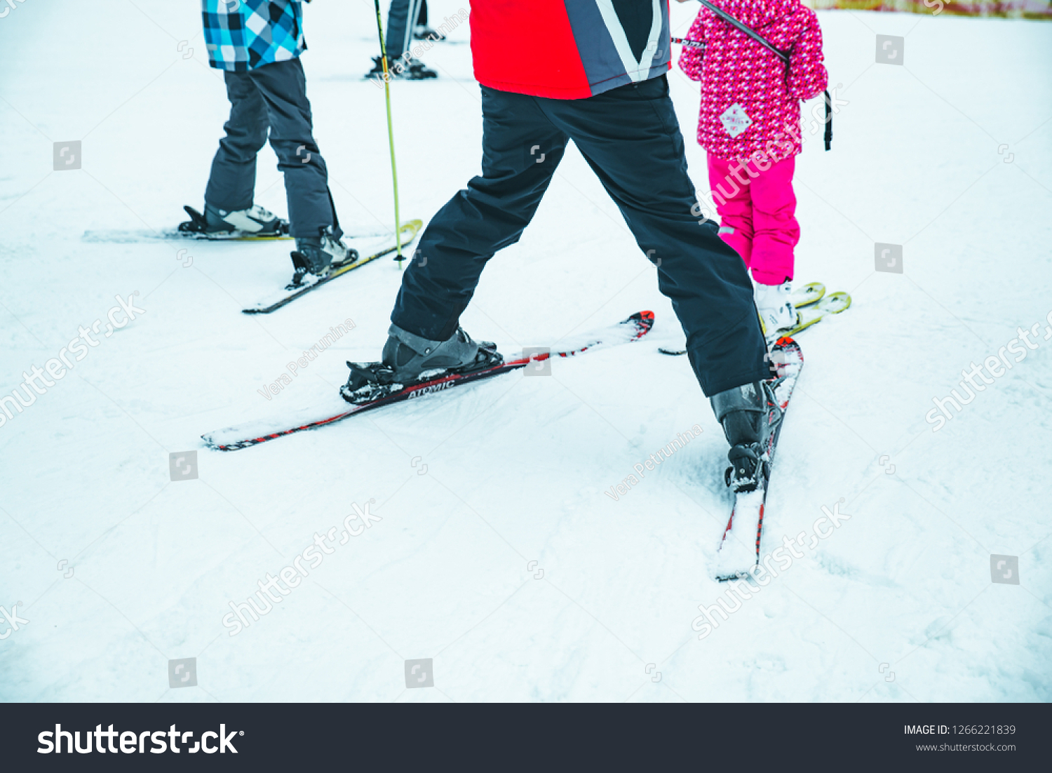 BUKOVEL, UKRAINE - December 9, 2018: legs of skiing people close up. winter vacation #1266221839