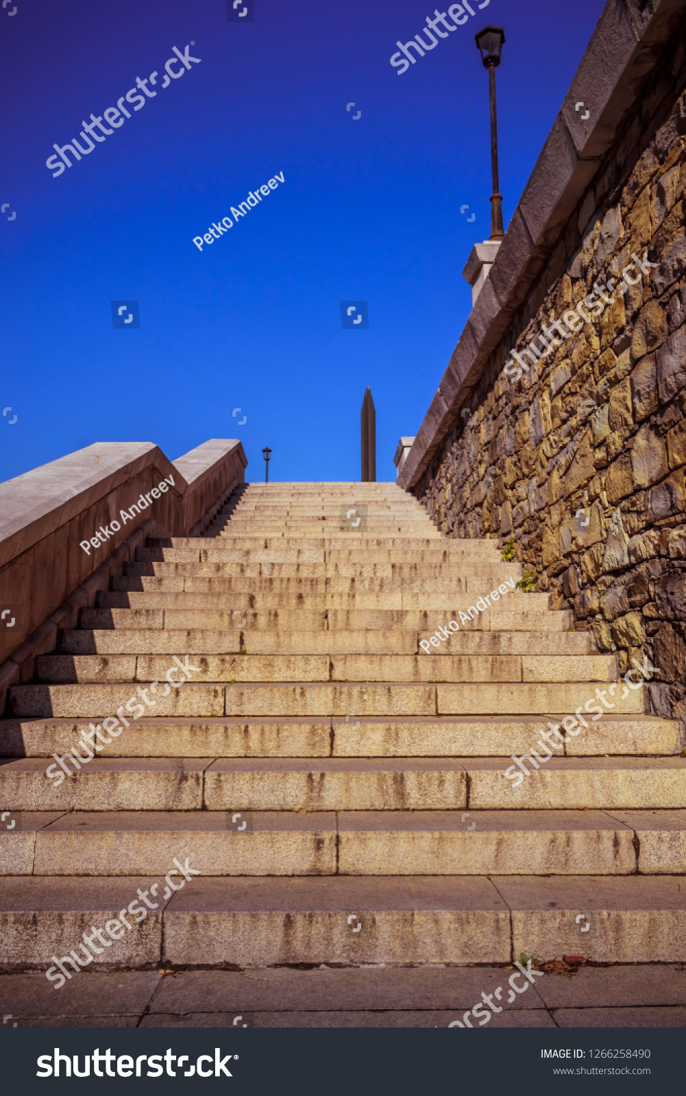 Stone stairways at the center of the city during a sunny day. #1266258490