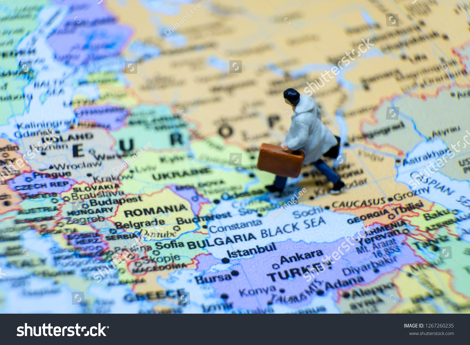 Business and journey concept. The businessman miniature figure walking on the world map for Europe #1267260235