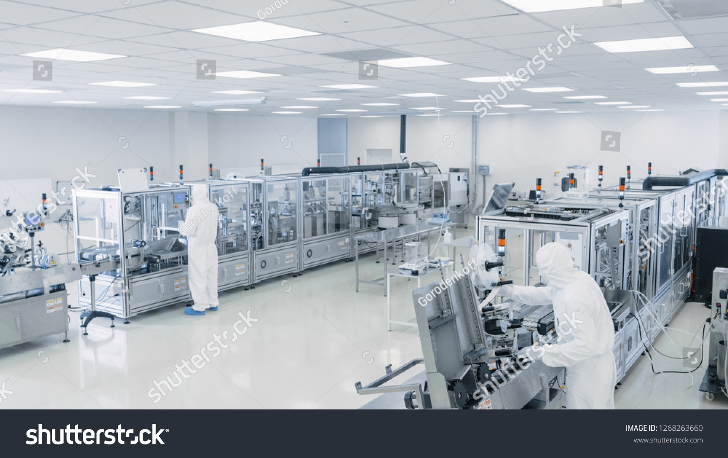 Sterile High Precision Manufacturing Laboratory where Scientists in Protective Coverall's Turn on Machninery, Use Computers and Microscopes, doing Pharmaceutics, Biotechnology Semiconductor Research. #1268263660