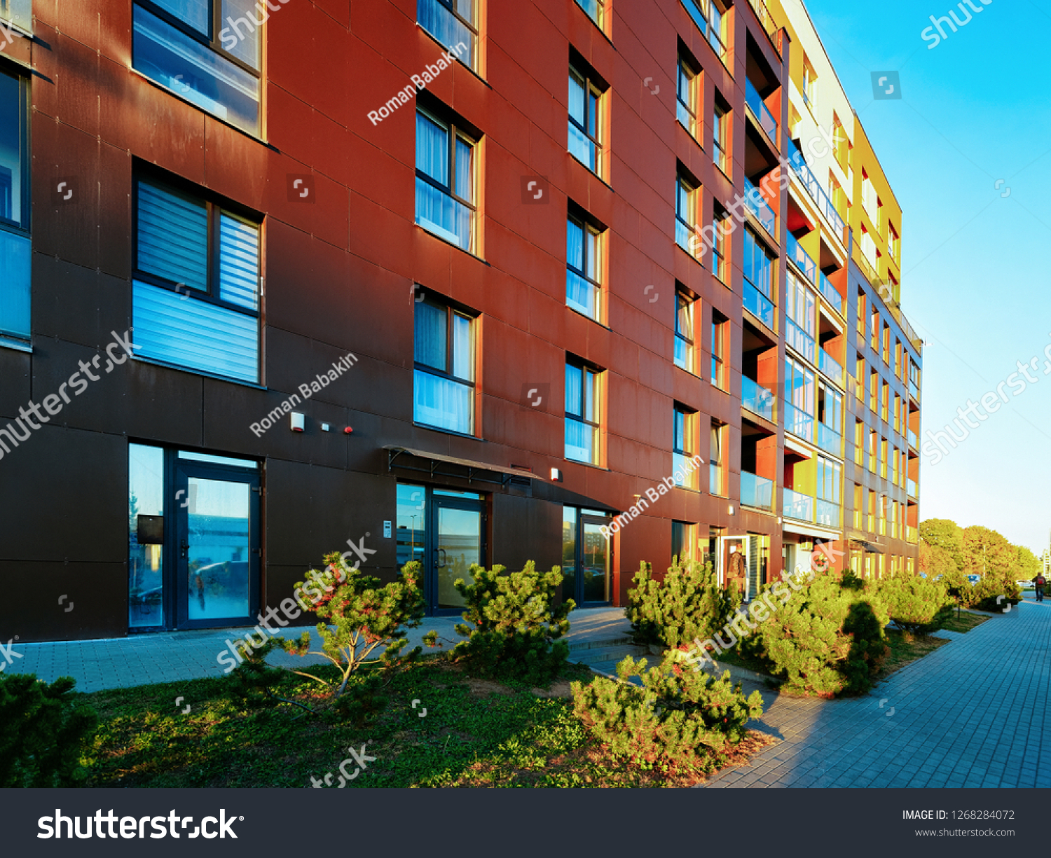 Vilnius, Lithuania - October 9, 2018: Residential Apartment homes facade architecture with outdoor facilities. Blue sky on the background. #1268284072