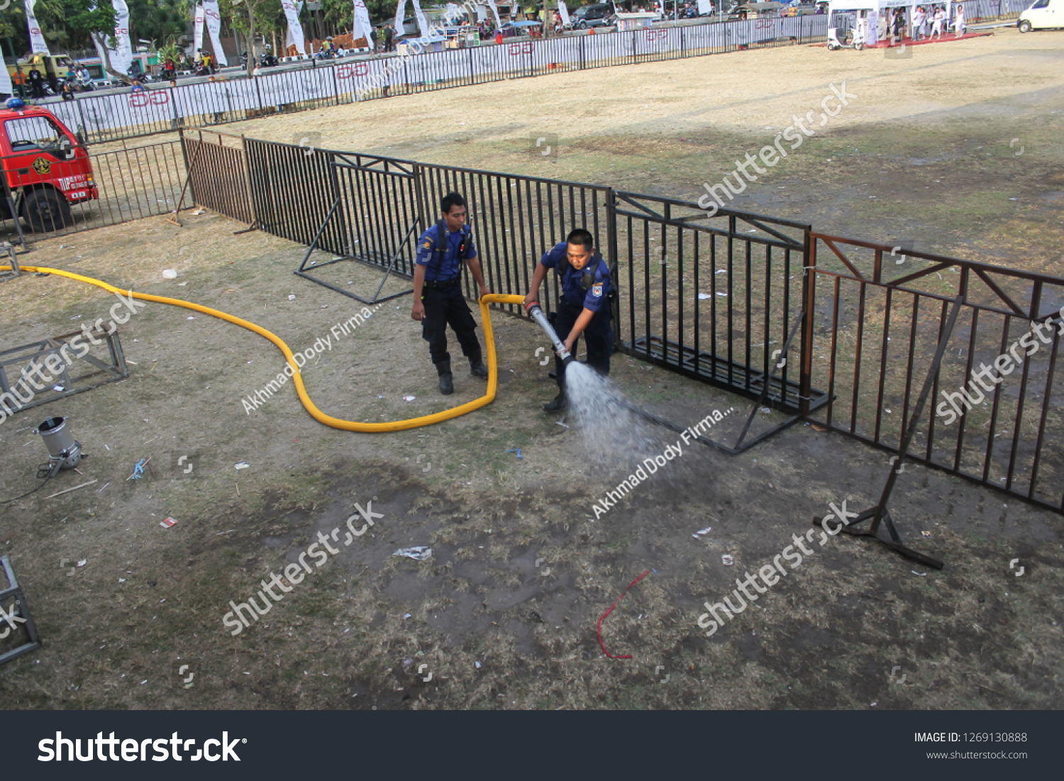 Linggau, Indonesia - 28th 08 2013: Fireman Spraying Water #1269130888