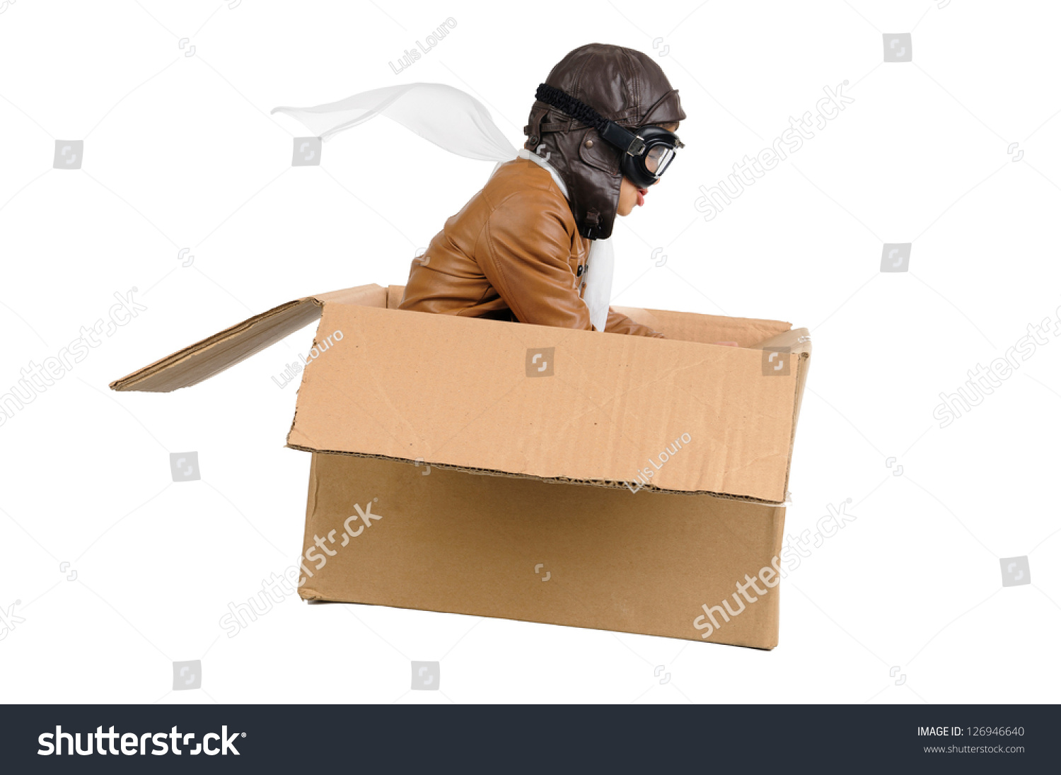 Young boy pilot flying a cardboard box isolated in white #126946640