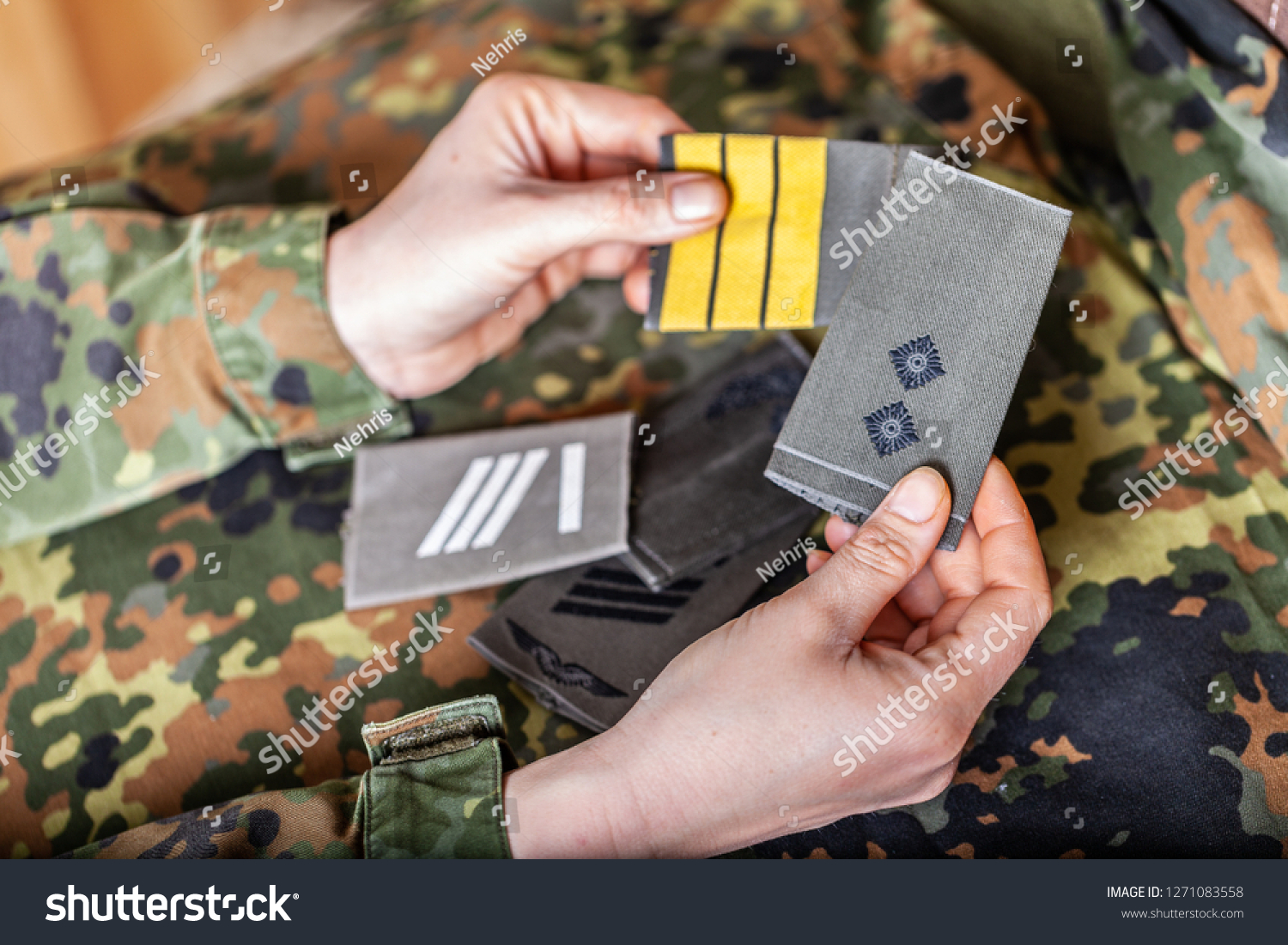 german shoulder ranks on a camouflage background #1271083558