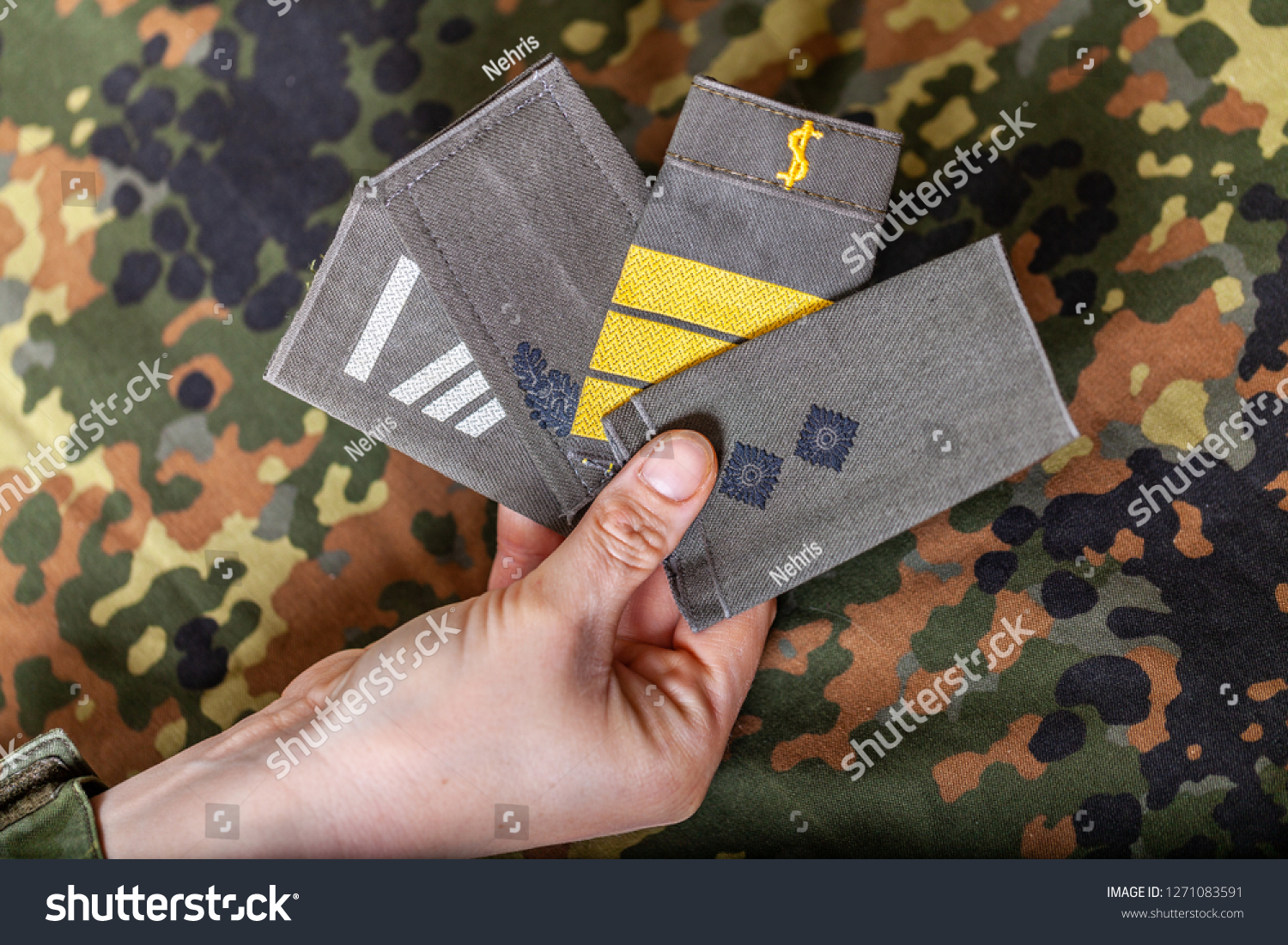 german shoulder ranks on a camouflage background #1271083591