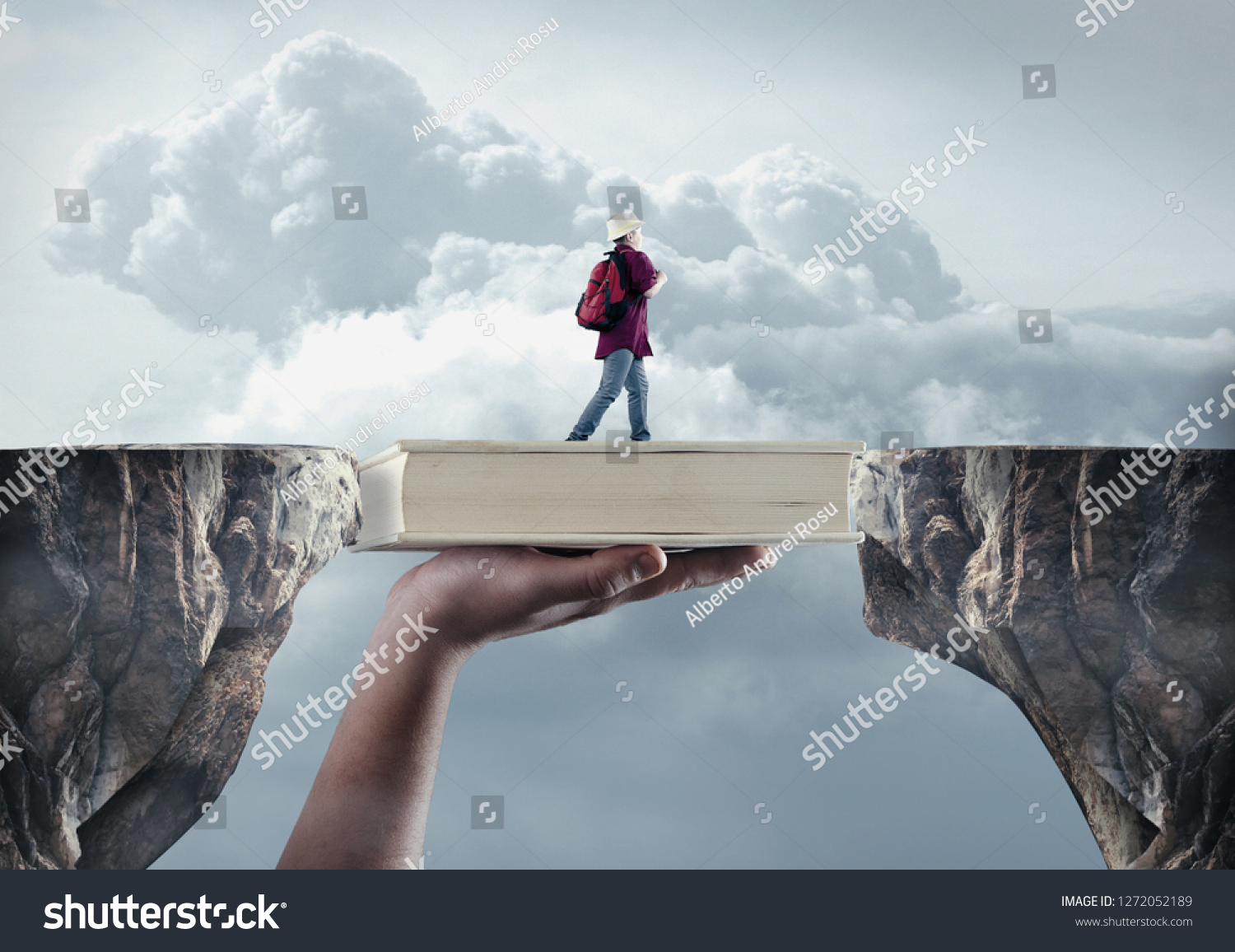 Young man passes from a peak to another on a book. The concept of scholarship. #1272052189