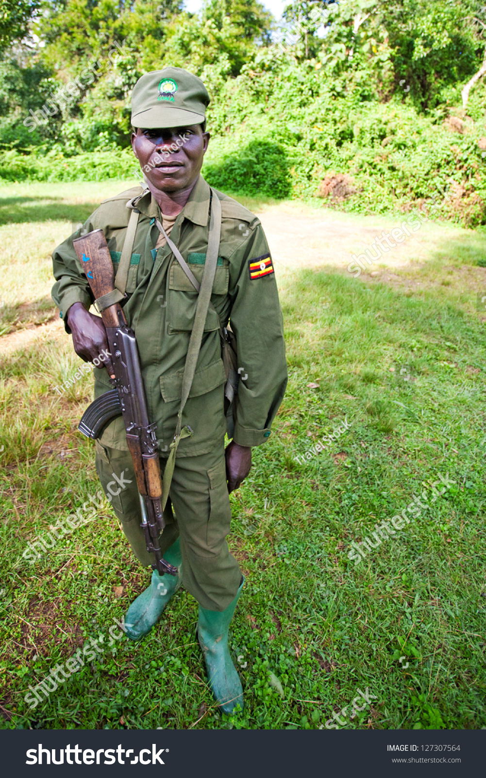 BWINDI, UGANDA - OCTOBER 22: Unidentified national park ranger on October 22, 2012 in the Bwindi National Park, Uganda. The Bwindi National Park is the most famous tourist attraction in Uganda. #127307564
